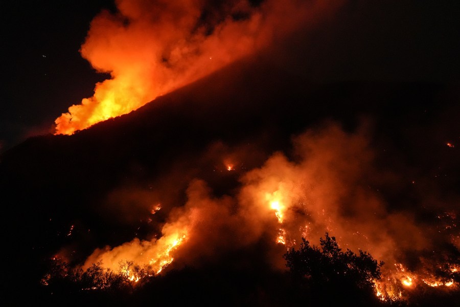 Flames erupt on a mountain as the Franklin Fire burns in Malibu, Calif., Tuesday, Dec. 10, 2024. (AP Photo/Jae C. Hong)