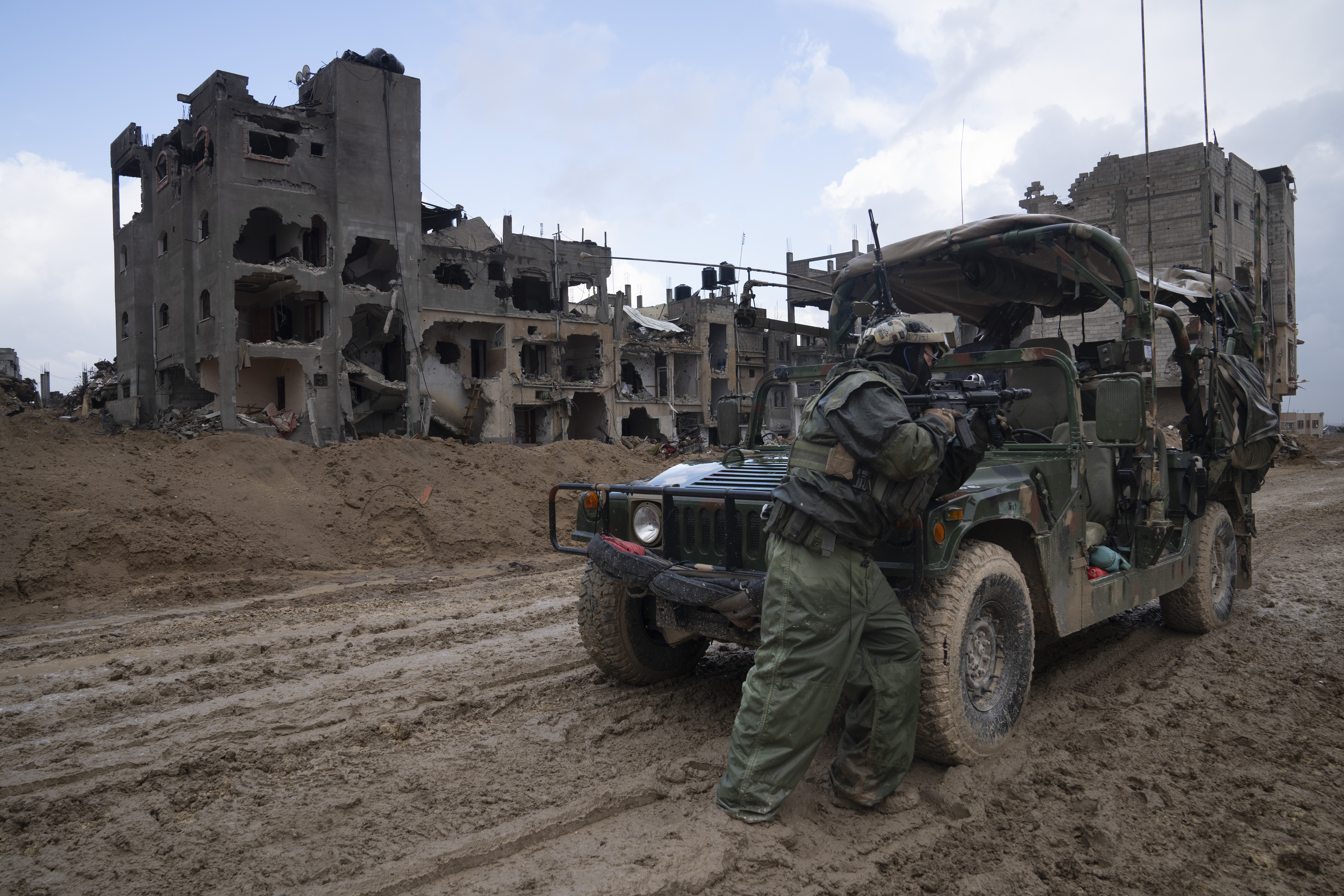 FILE - An Israeli soldier stands guard in Khan Younis, Jan. 27, 2024. (AP Photo/Sam McNeil, File)