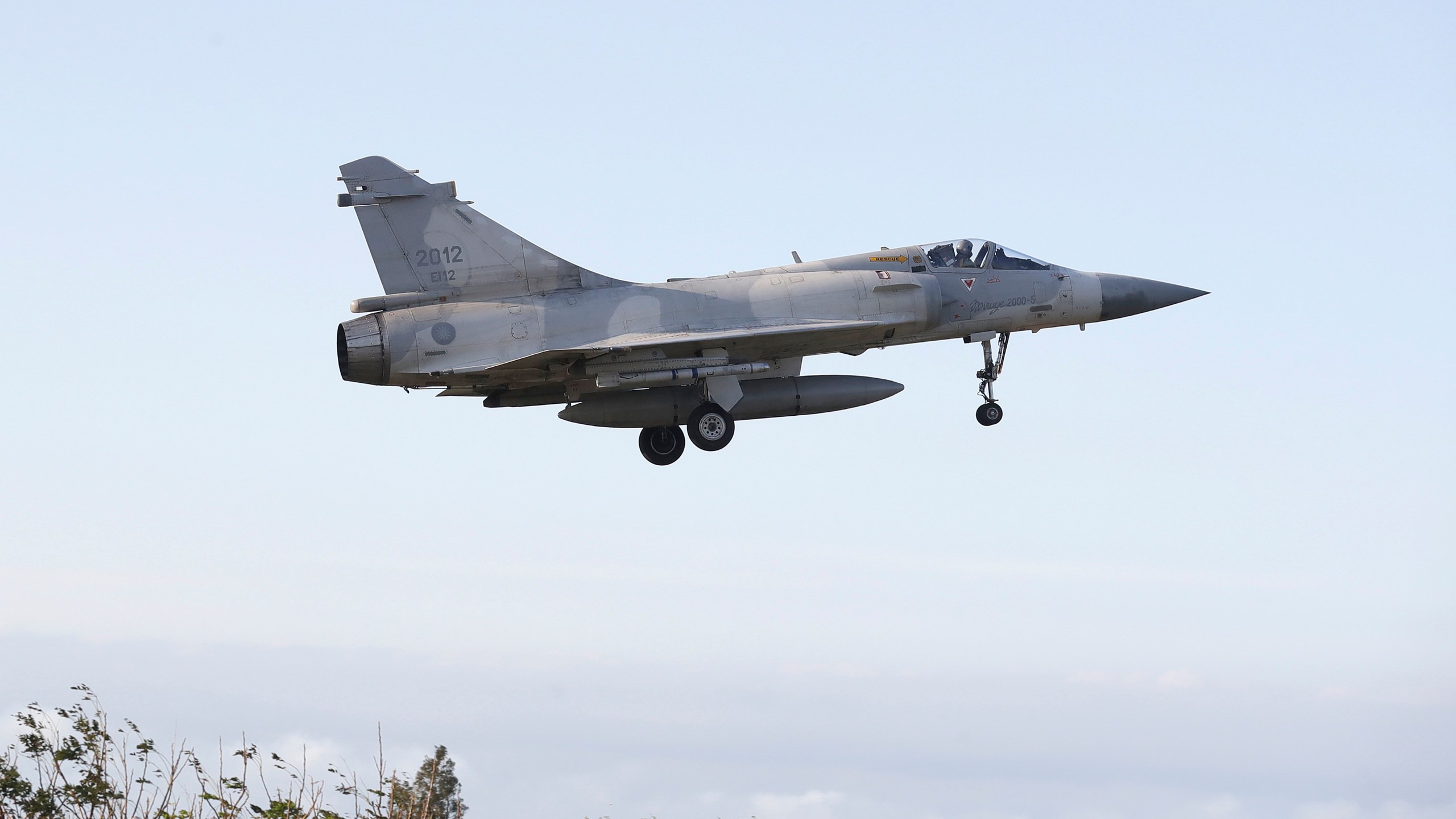 A Taiwan's fighter jet lands at an airbase in Hsinchu, northern Taiwan, Tuesday, Dec. 10, 2024, as Taiwan's Defense Ministry said it detected Chinese naval ships and military planes engaged in training. (AP Photo/Chiang Ying-ying)