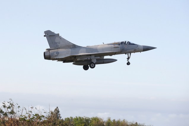 A Taiwan's fighter jet lands at an airbase in Hsinchu, northern Taiwan, Tuesday, Dec. 10, 2024, as Taiwan's Defense Ministry said it detected Chinese naval ships and military planes engaged in training. (AP Photo/Chiang Ying-ying)