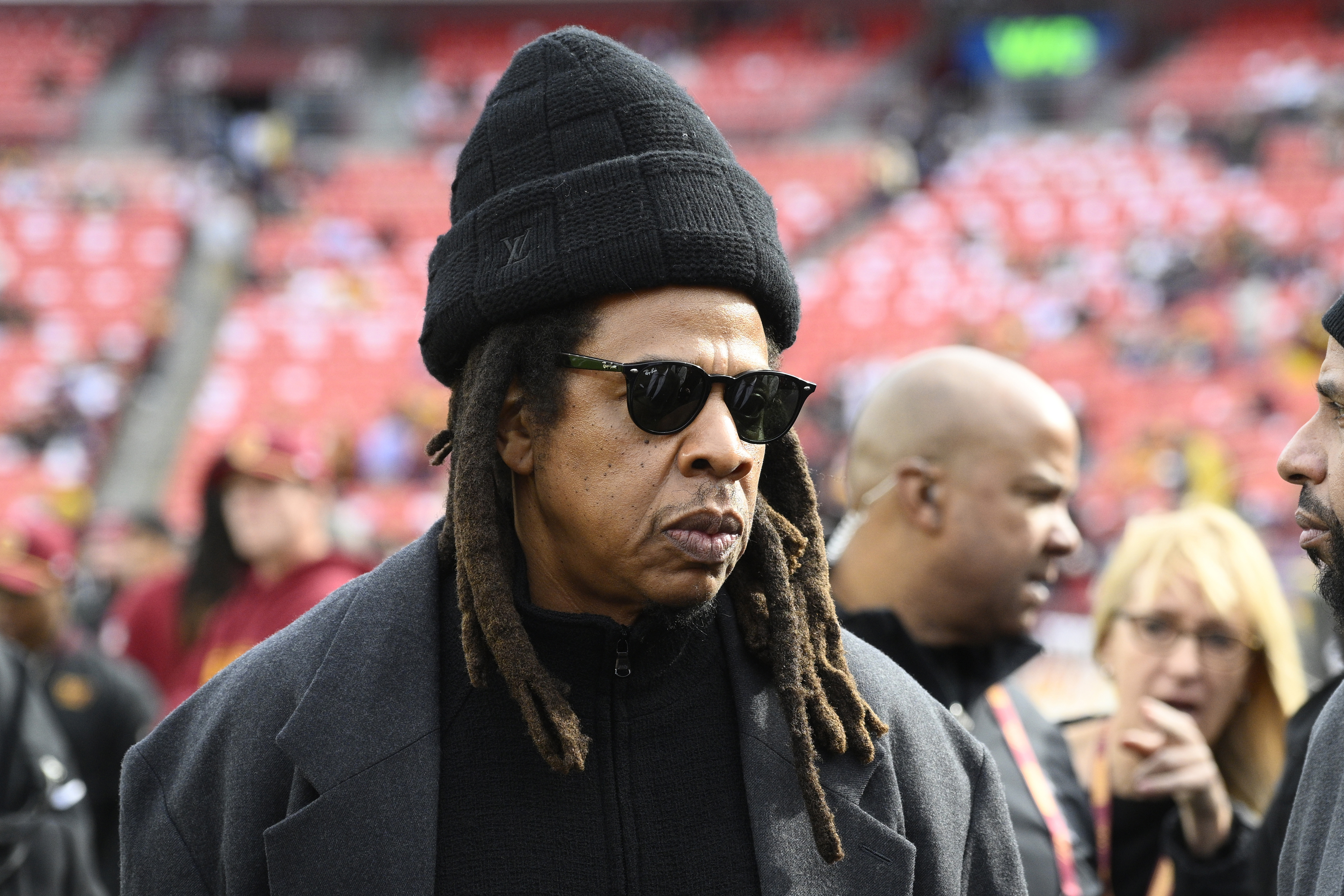 FILE - Musician Jay-Z stands on the field before an NFL football game between the Washington Commanders and Dallas Cowboys, on Nov. 24, 2024, in Landover, Md. (AP Photo/Nick Wass, File)