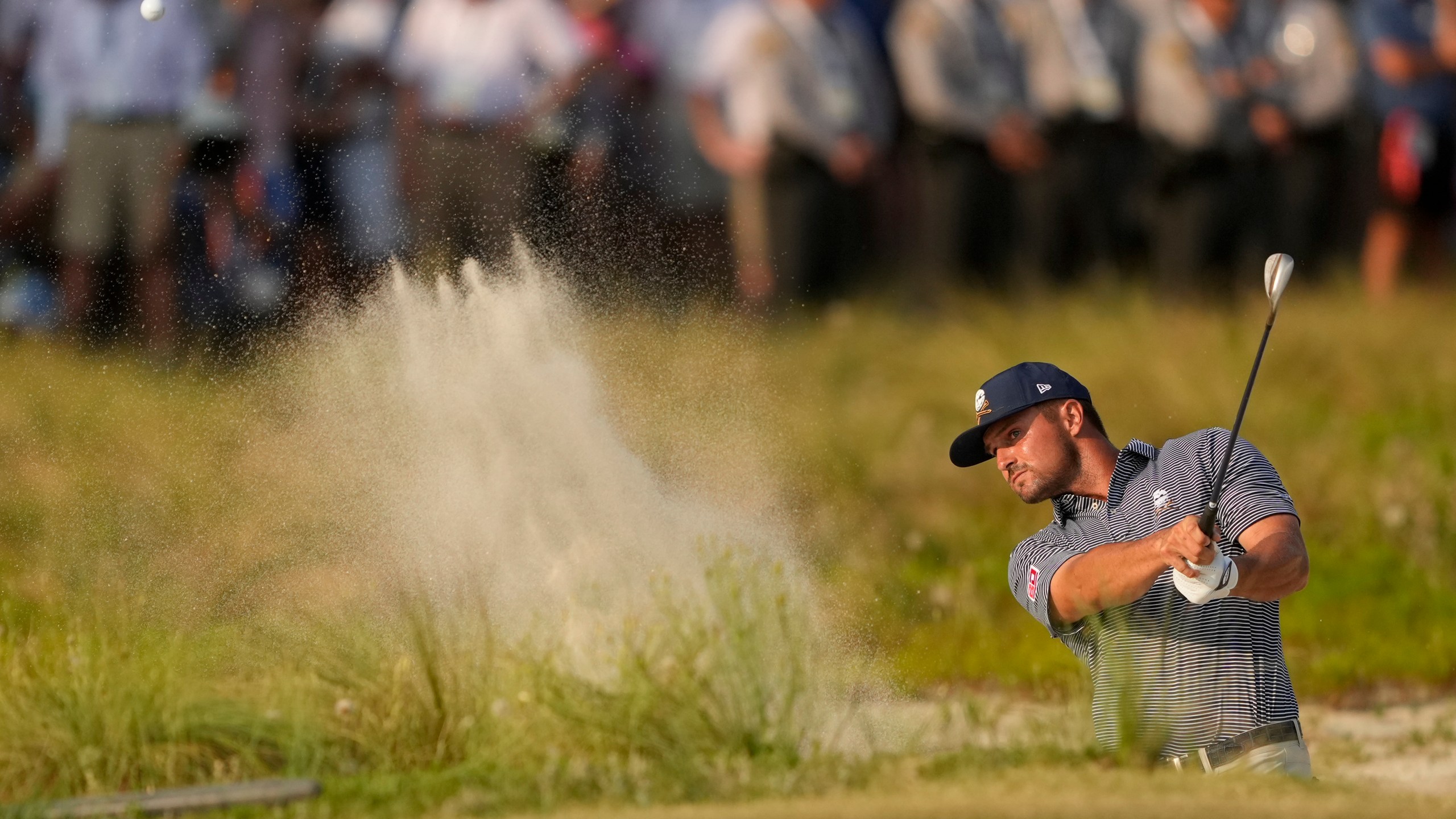 FILE - Bryson DeChambeau hits from the bunker on the 18th hole during the final round of the U.S. Open golf tournament Sunday, June 16, 2024, in Pinehurst, N.C. (AP Photo/Matt York, File)