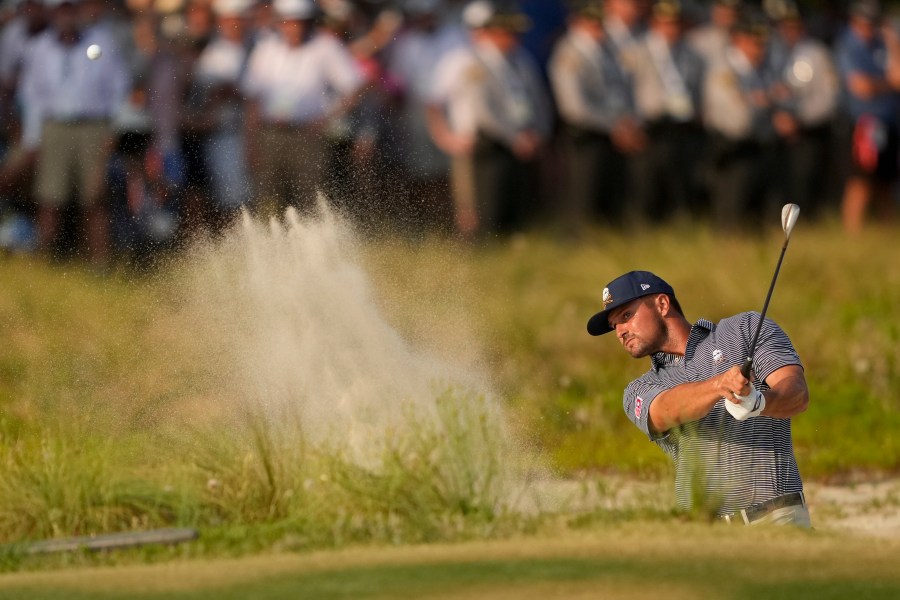 FILE - Bryson DeChambeau hits from the bunker on the 18th hole during the final round of the U.S. Open golf tournament Sunday, June 16, 2024, in Pinehurst, N.C. (AP Photo/Matt York, File)