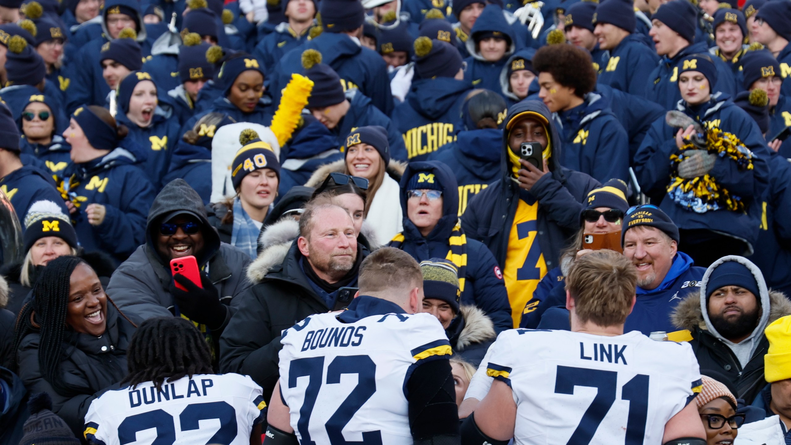 Michigan players celebrate their win over Ohio State in an NCAA college football game Saturday, Nov. 30, 2024, in Columbus, Ohio. (AP Photo/Jay LaPrete)