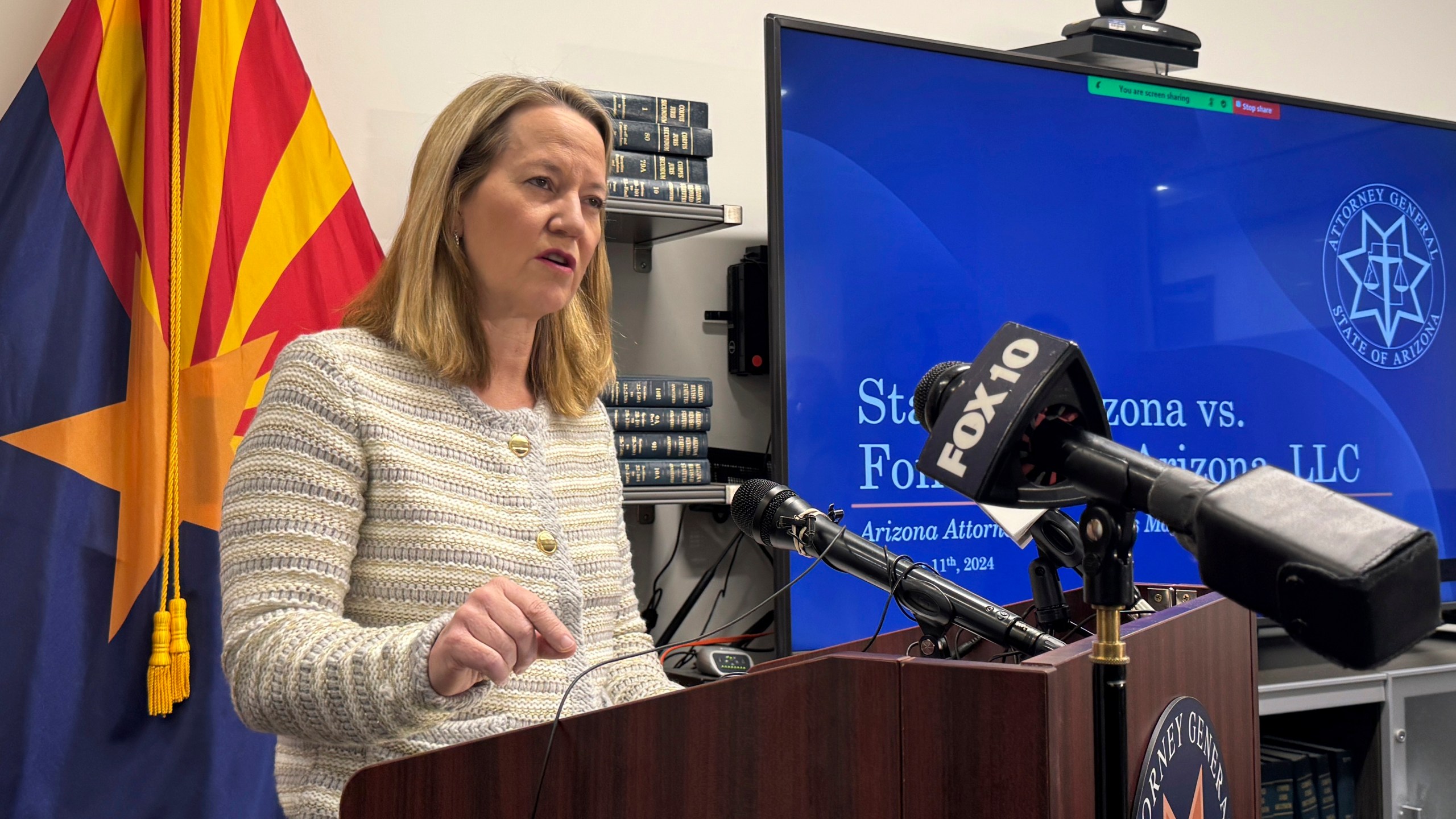 Arizona Attorney General Kris Mayes announces she's suing a Saudi Arabian company for allegedly pumping groundwater that harms local communities in a rural western county, Wednesday, Dec. 11, 2024, in Phoenix. (AP Photo/Gabriel Sandoval)