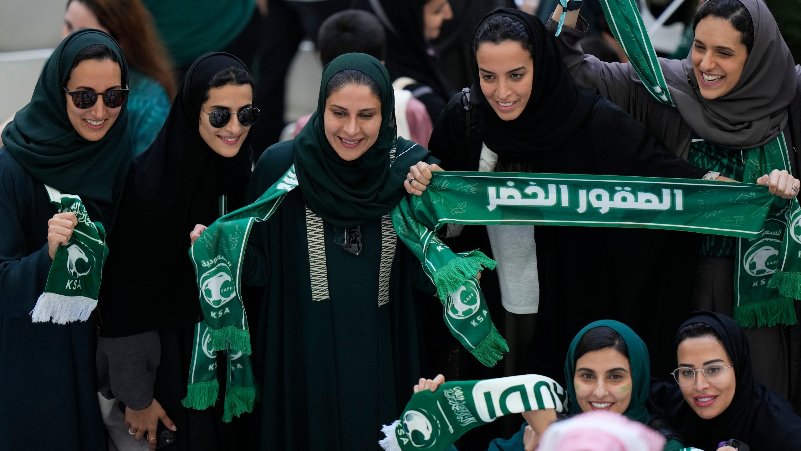 FILE - Saudi women supporters celebrate after Saudi Arabia won the World Cup group C soccer match between Argentina and Saudi Arabia at the Lusail Stadium in Lusail, Qatar, on Nov. 22, 2022. (AP Photo/Luca Bruno, File)