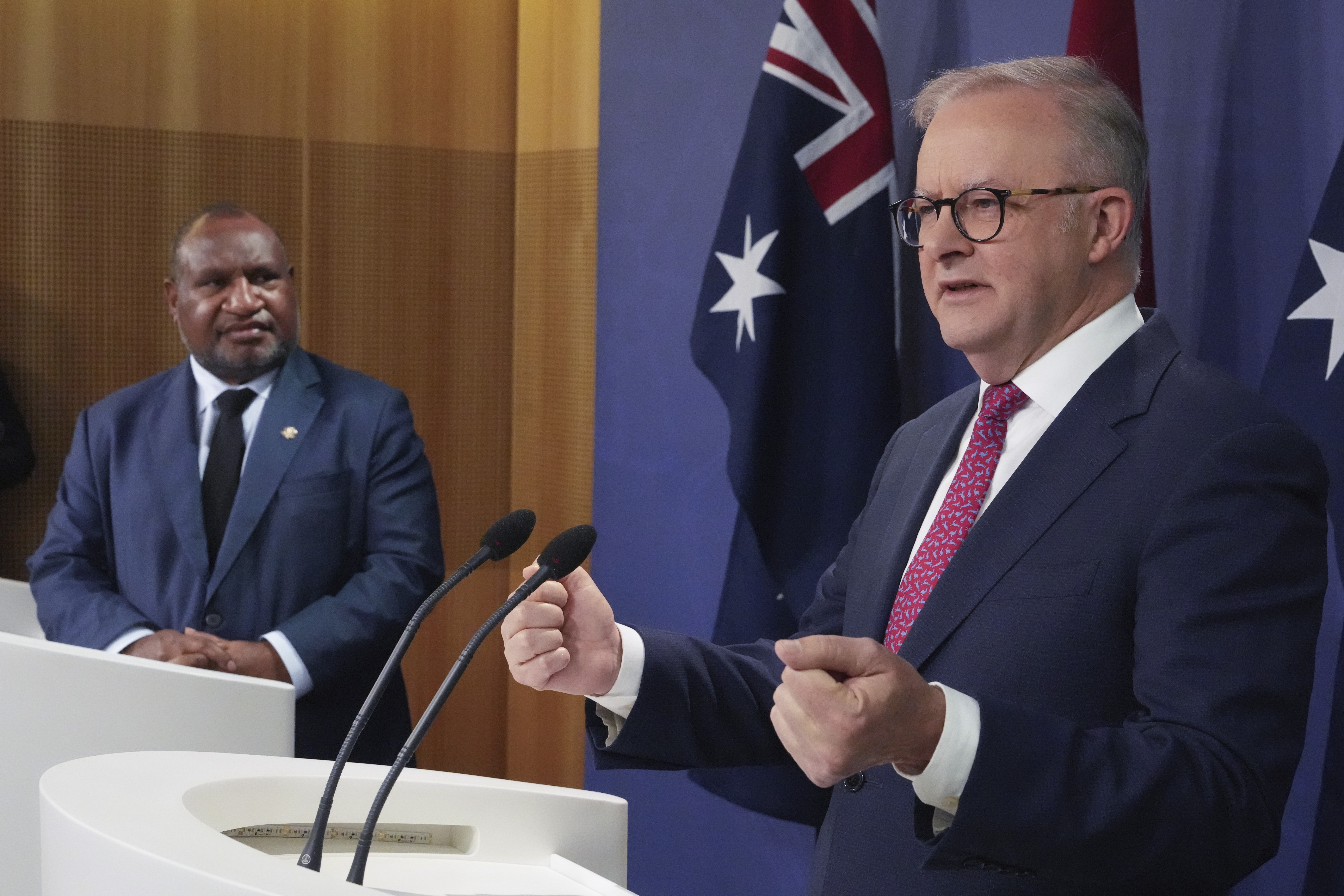 Australian Prime Minister Anthony Albanese, right, gestures during a press conference with Papua New Guinea Prime Minister James Marape in Sydney, Australia, Thursday, Dec. 12, 2024. (AP Photo/Mark Baker)