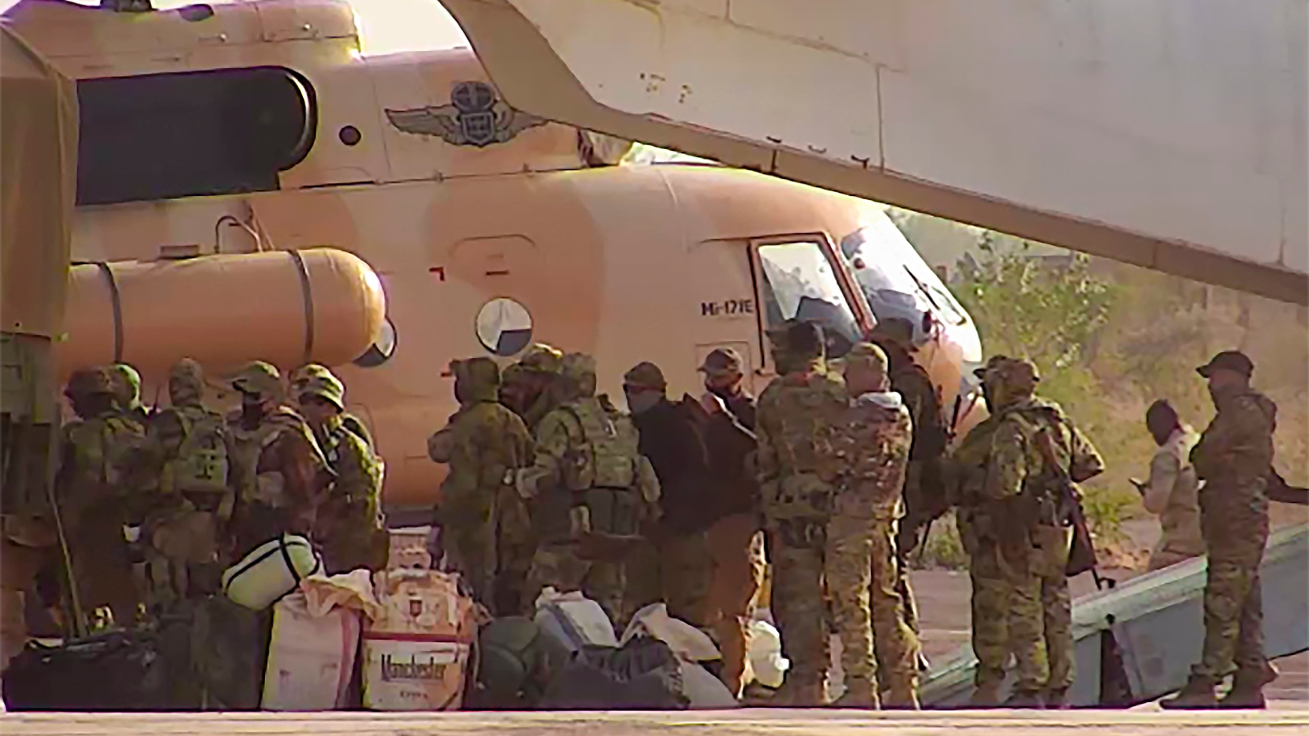 FILE - This undated photograph released in April 2022 by France's military shows Russian mercenaries boarding a helicopter in northern Mali. (French Army via AP, File)