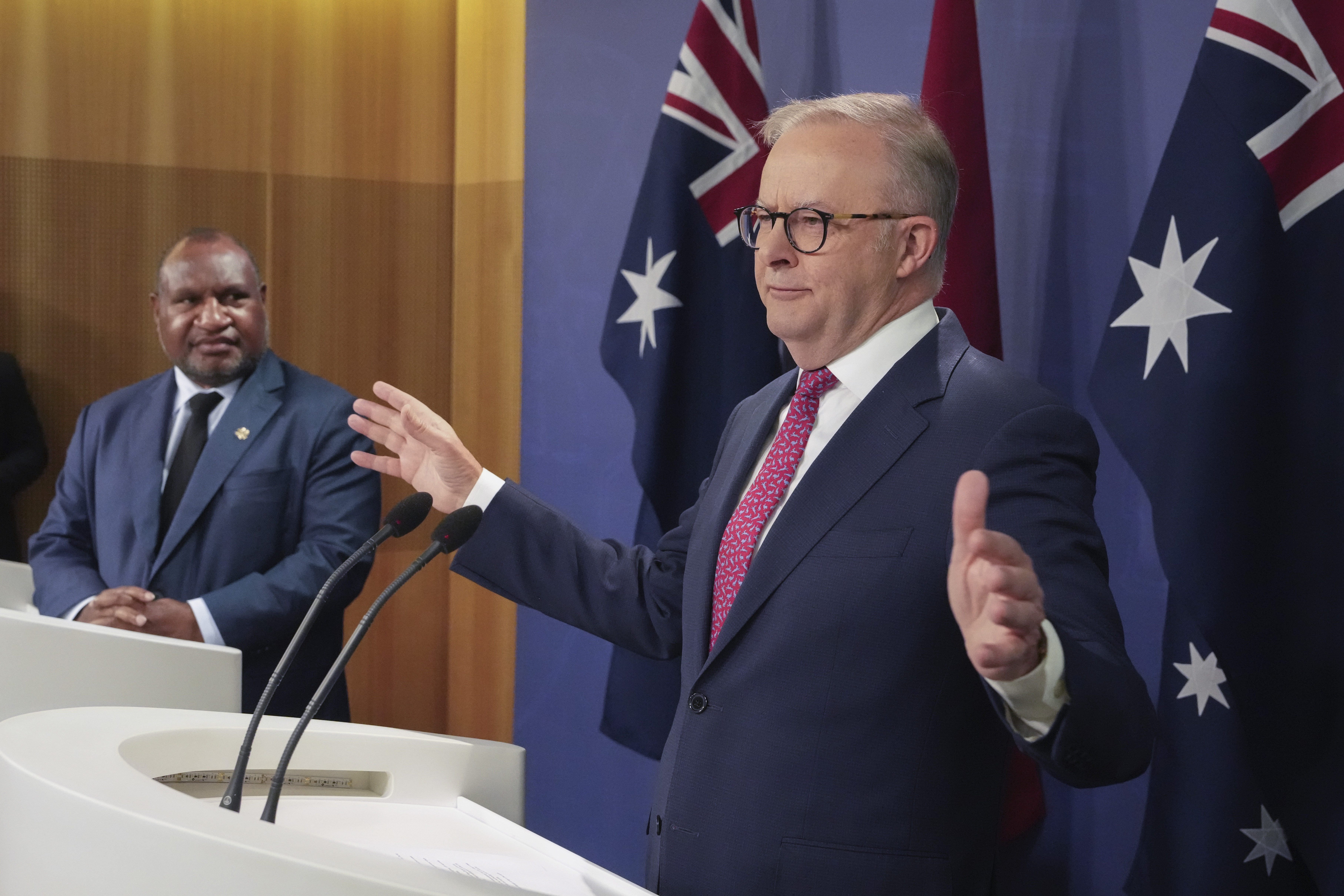 Australian Prime Minister Anthony Albanese, right, gestures during a press conference with Papua New Guinea Prime Minister James Marape in Sydney, Australia, Thursday, Dec. 12, 2024. (AP Photo/Mark Baker)