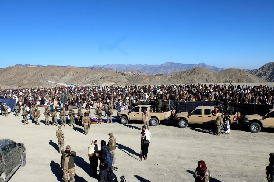 People attend the funeral prayer of Khalil Haqqani, the minister for refugees and repatriation, during his funeral procession in eastern Paktia province, Afghanistan, Thursday, Dec. 12, 2024. (AP Photo/Saifullah Zahir)