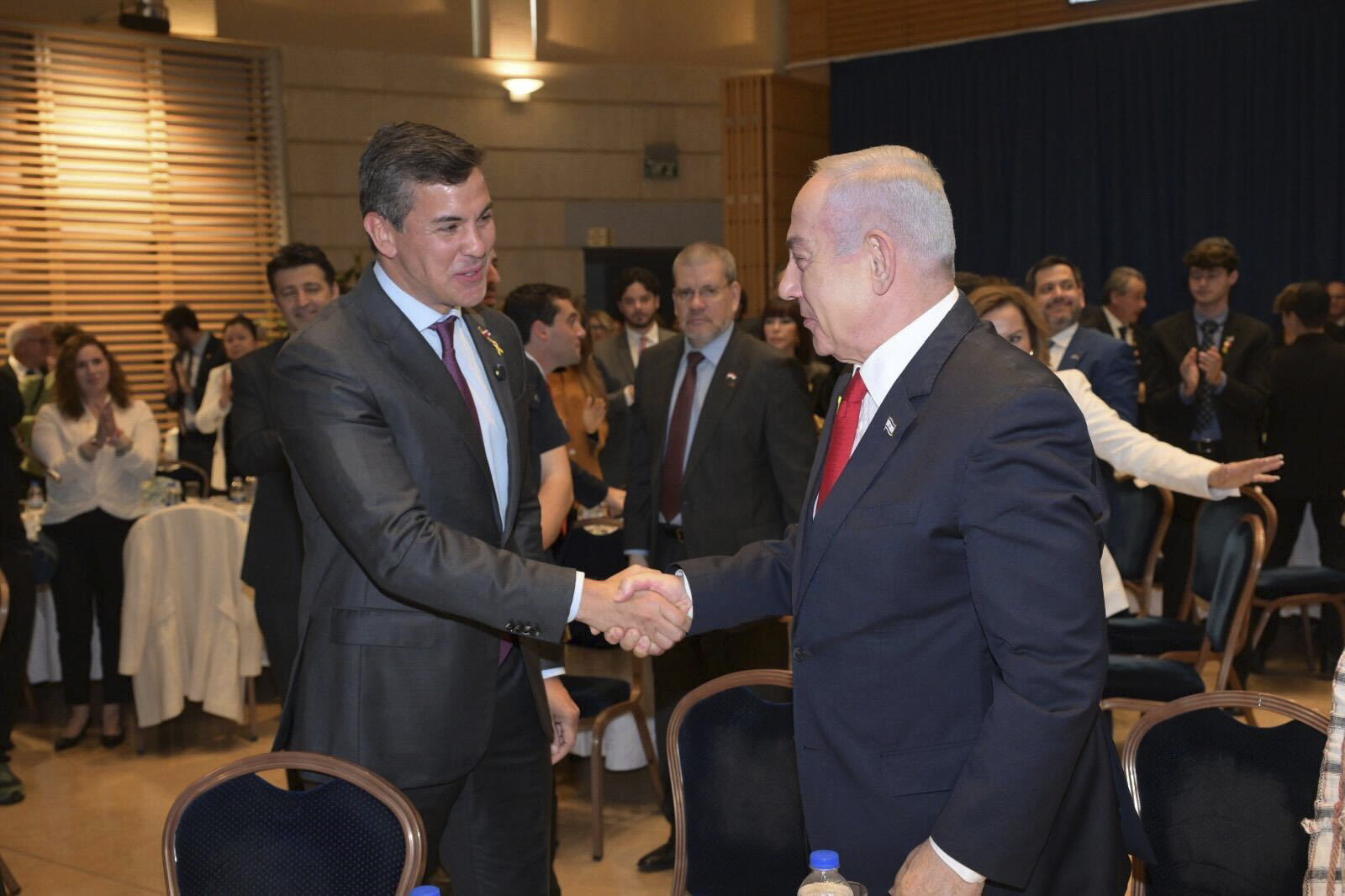 Paraguay's President Santiago Pena, left, shakes hands with Israeli Prime Minister Benjamin Netanyahu in Jerusalem, Thursday, Dec. 12, 2024. (Amos Ben-Gershom/GPO via AP)