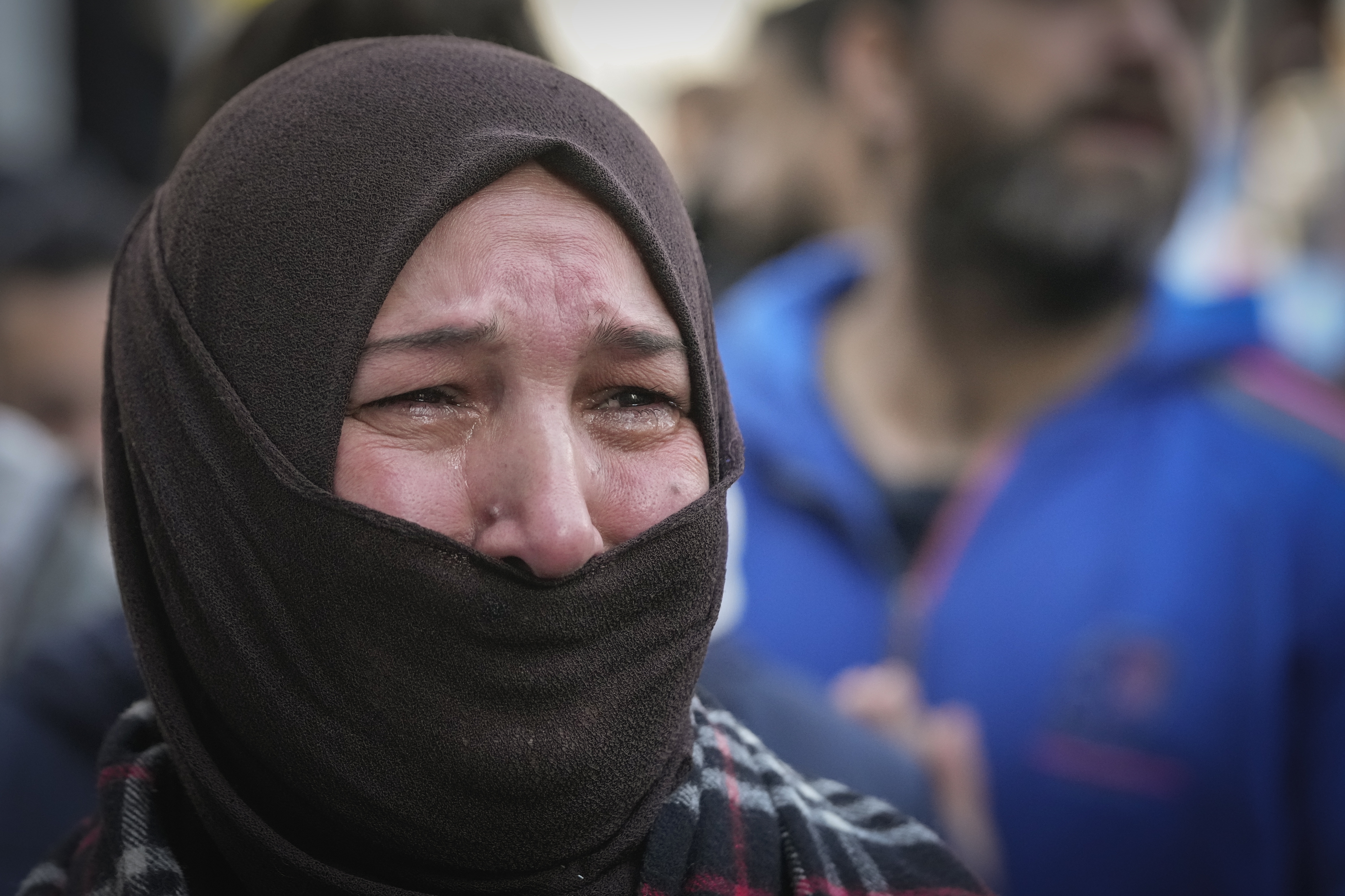 A woman cries during the funeral of Syrian activist Mazen al-Hamada in Damascus Thursday Dec. 12, 2024. Al-Hamad's mangled corpse was found wrapped in a bloody sheet in Saydnaya prison. He had fled to Europe but returned to Syria in 2020 and was imprisoned upon arrival. (AP Photo/Hussein Malla)