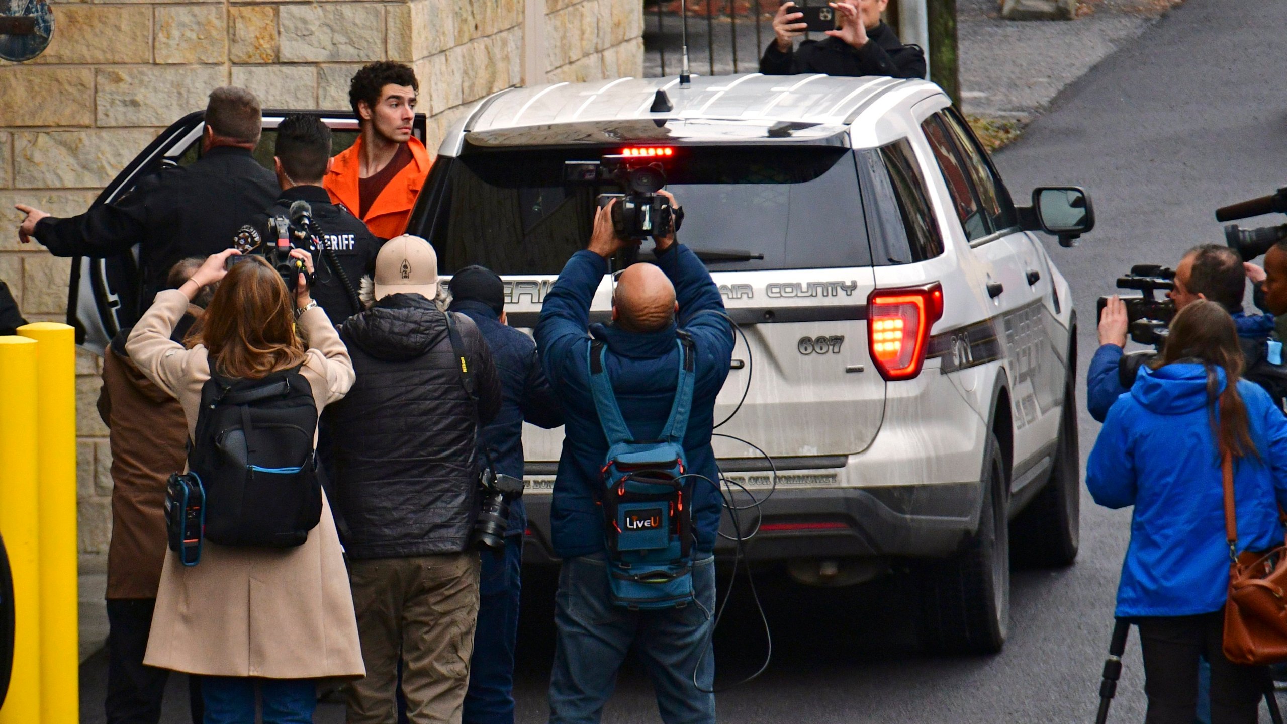 Suspect Luigi Mangione is taken into the Blair County Courthouse on Tuesday, Dec. 10, 2024, in Hollidaysburg, Pa. (Janet Klingbeil via AP)