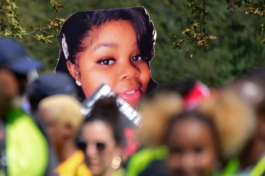 FILE - An image of Breonna Taylor, a 26-year-old Black woman who was fatally shot by police in her Louisville, Ky., apartment, is seen as people march to honor the 60th Anniversary of the March on Washington, Saturday, Aug. 26, 2023, in Washington. (AP Photo/Jacquelyn Martin, File)