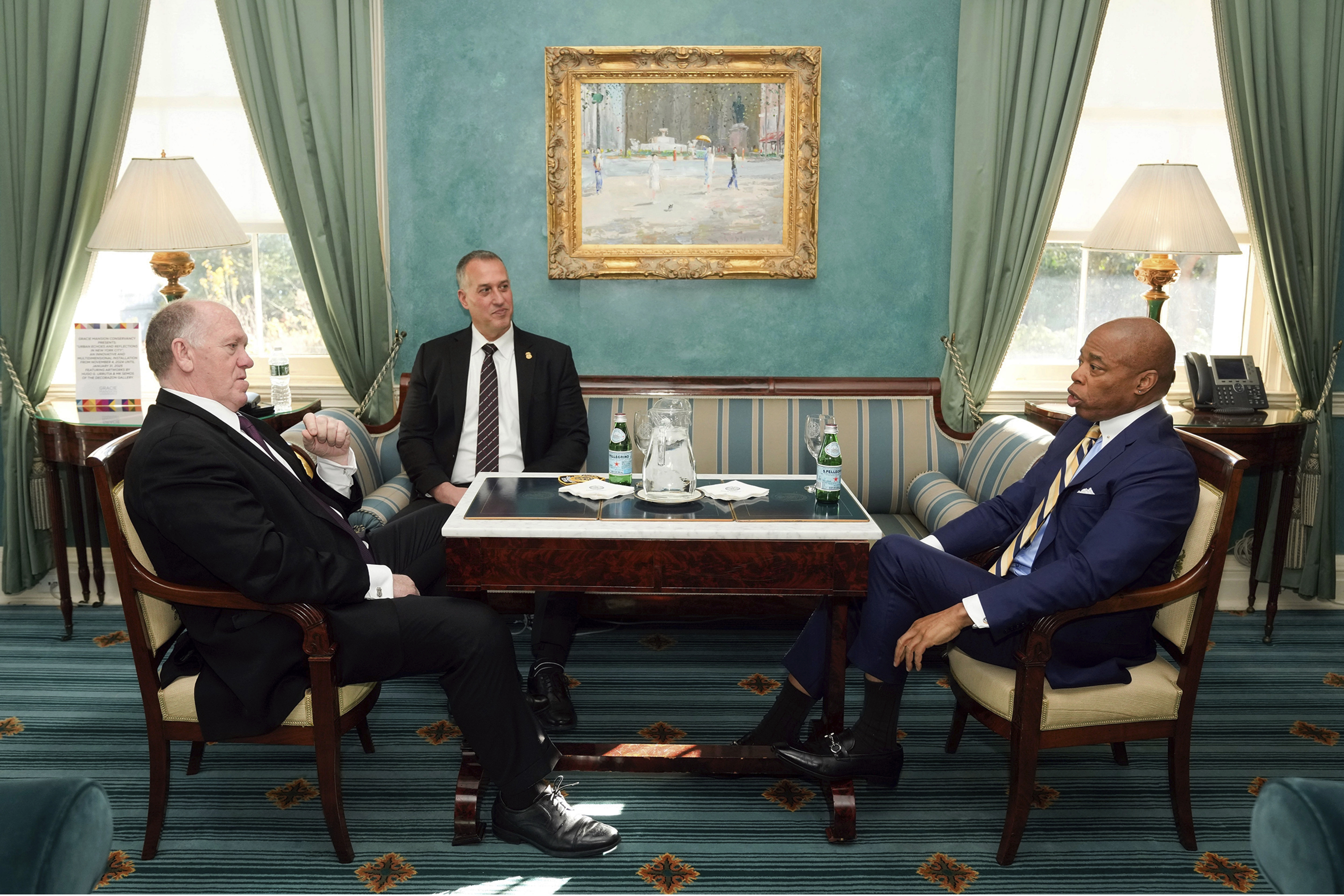 This image provided by the Office of the New York Mayor shows New York Mayor Eric Adams, right, meeting with President-elect Donald Trump's incoming "border czar" Tom Homan, left, and President Joe Biden's Department of Homeland Security Official Kenneth Genalo at Gracie Mansion, in New York, Thursday, Dec. 12, 2024. (Mayoral Photography Office/Michael Appleton via AP)