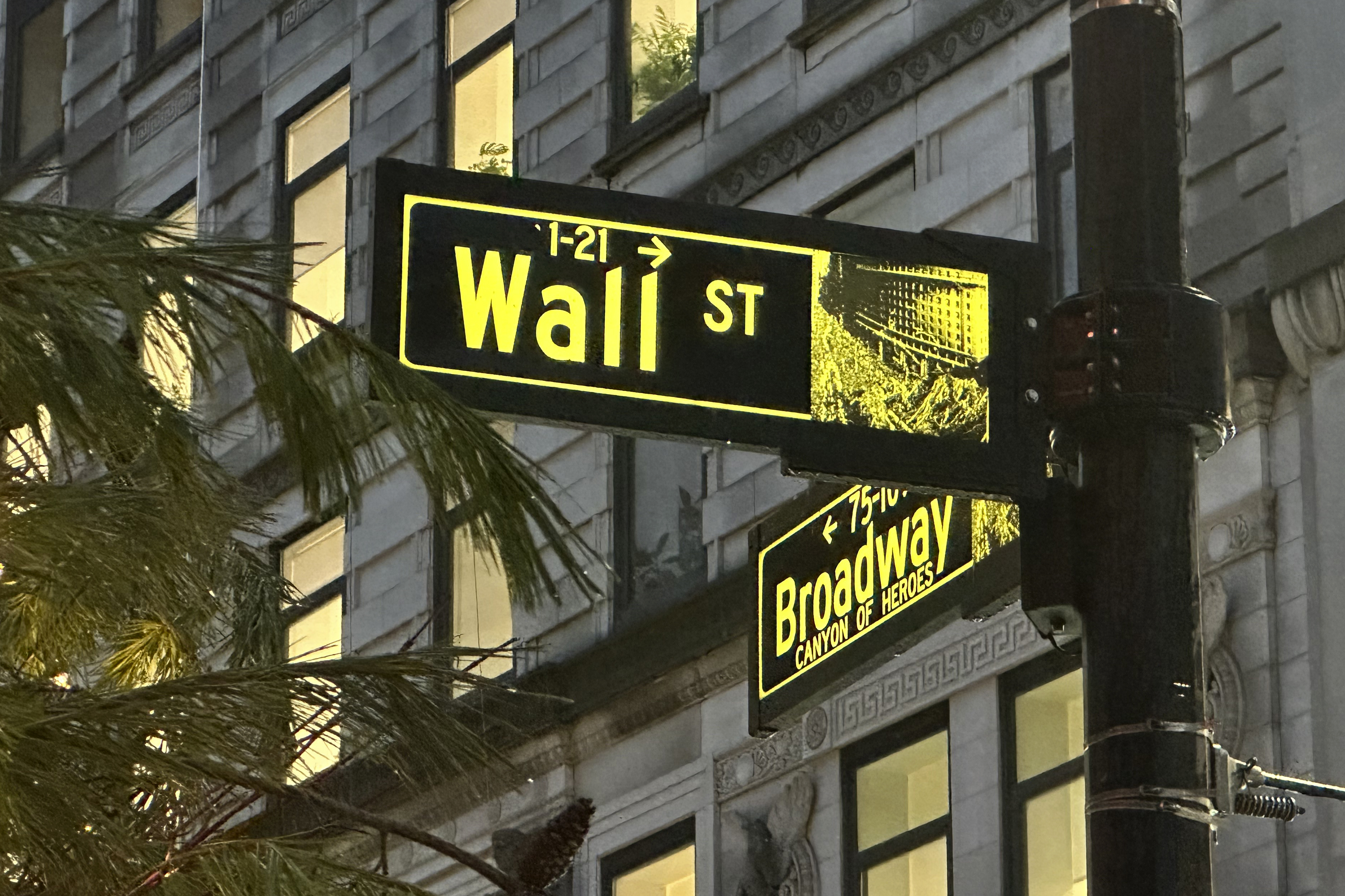 Signs mark the intersection of Wall Street and Broadway in New York's Financial District on Wednesday Dec.11, 2024. (AP Photo/Peter Morgan)