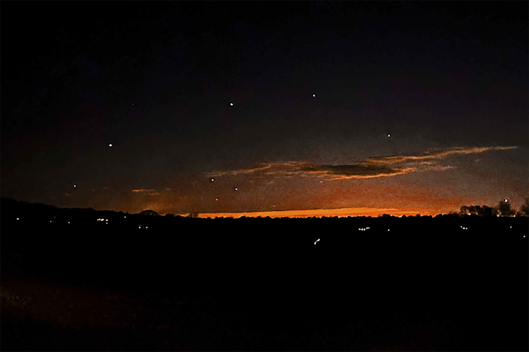 This photo provided by Trisha Bushey shows the evening sky and points of light near in Lebanon Township, N.J., on Thursday, Dec. 5, 2024. (Trisha Bushey via AP)