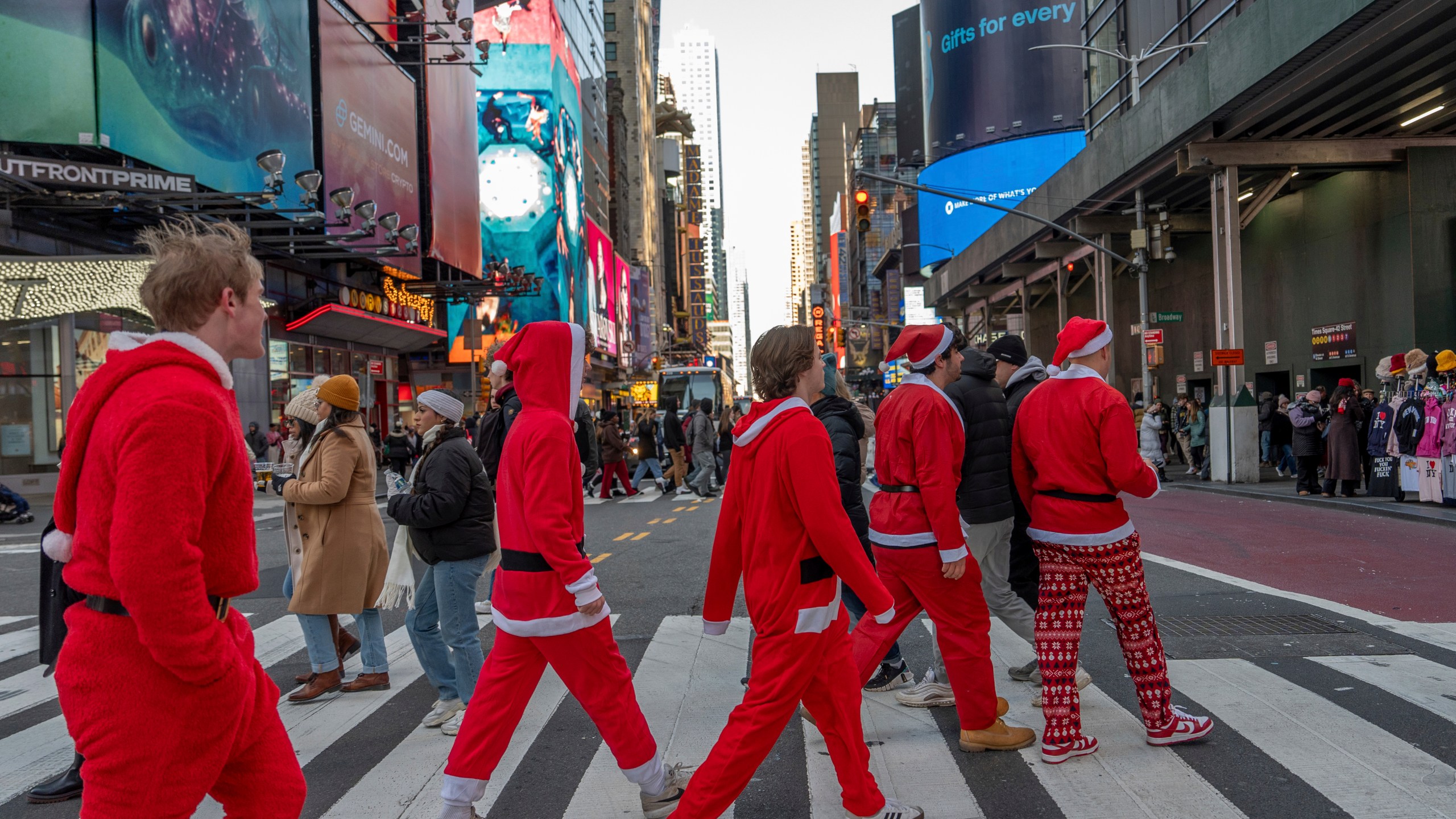 Revellers take part in SantaCon, Saturday, Dec. 14, 2024, in New York. (AP Photo/Julia Demaree Nikhinson)