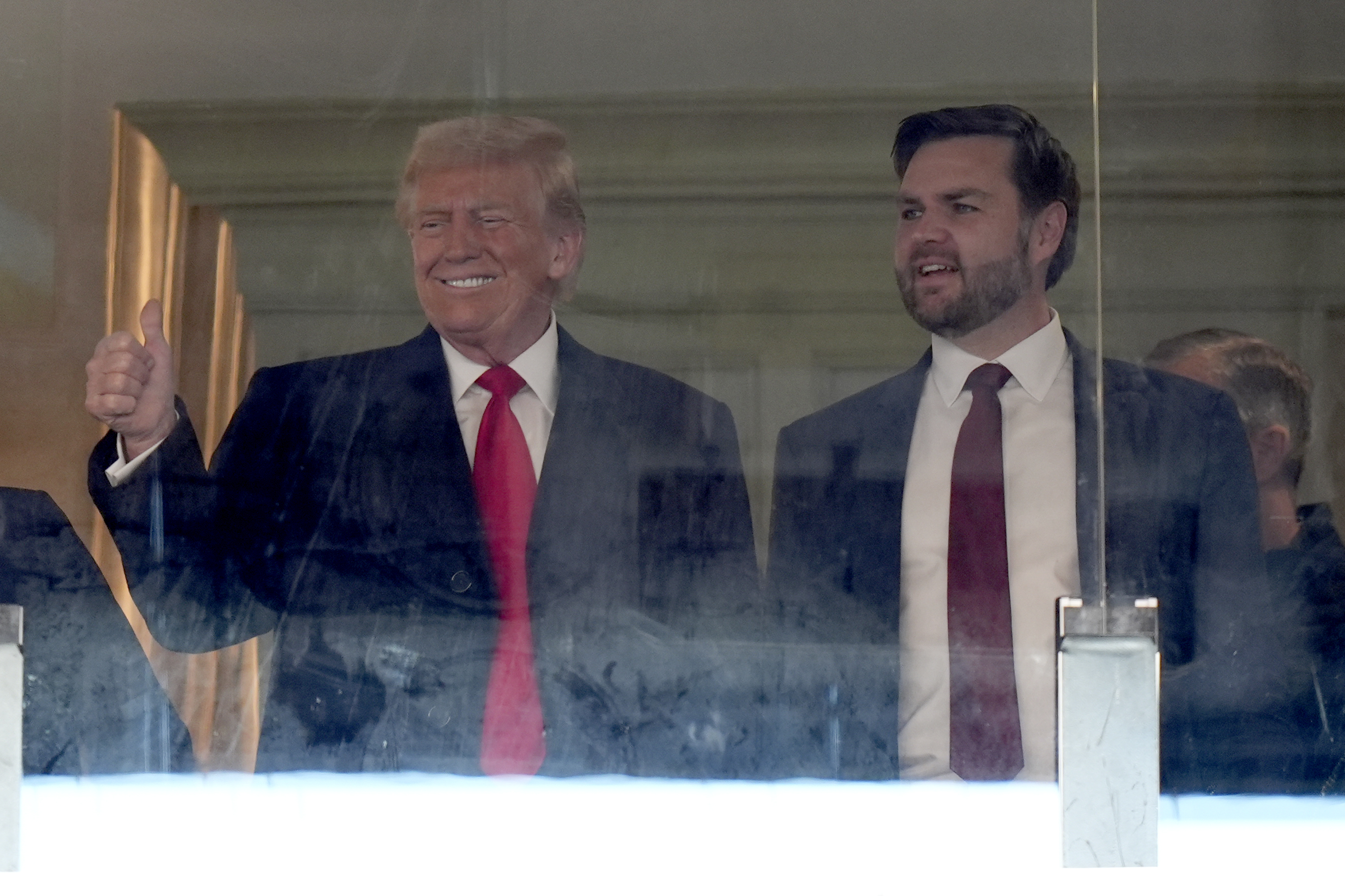 President-elect Donald Trump, left, and Vice President-elect JD Vance attend the NCAA college football game between Army and Navy at Northwest Stadium in Landover, Md., Saturday, Dec. 14, 2024. (AP Photo/Stephanie Scarbrough)