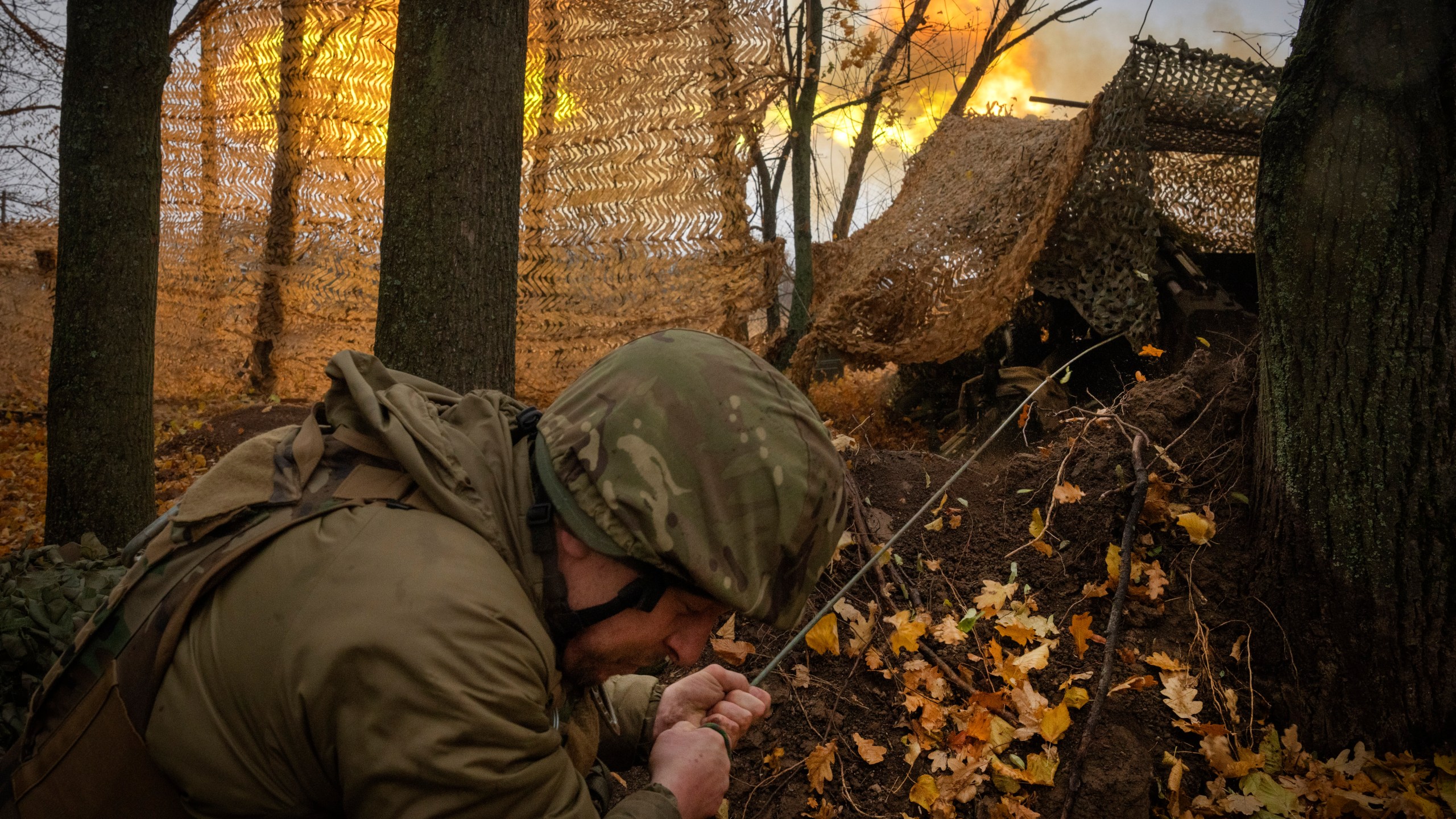 FILE - A serviceman of the 13th Brigade of the National Guard of Ukraine fires Giatsint-B gun towards Russian positions near Kharkiv, Ukraine, on Nov. 6, 2024. (AP Photo/Efrem Lukatsky, File)