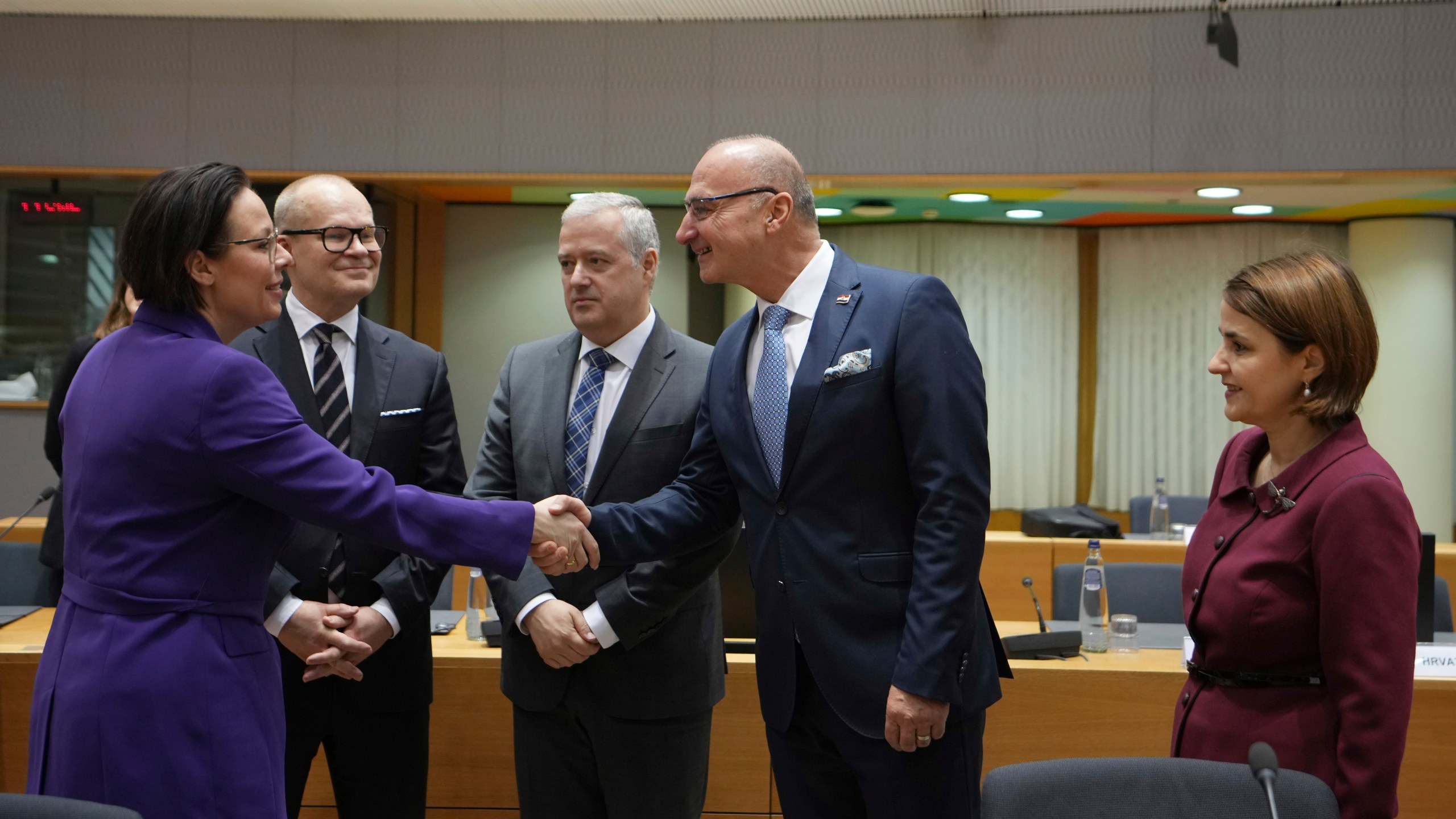 Sweden's Foreign Minister Maria Malmer Stenergard, left, shakes hands with Croatia's Foreign Minister Gordan Grlic Radman, second right, during a meeting of EU foreign ministers at the European Council building in Brussels, Monday, Dec 16, 2024. (AP Photo/Virginia Mayo)