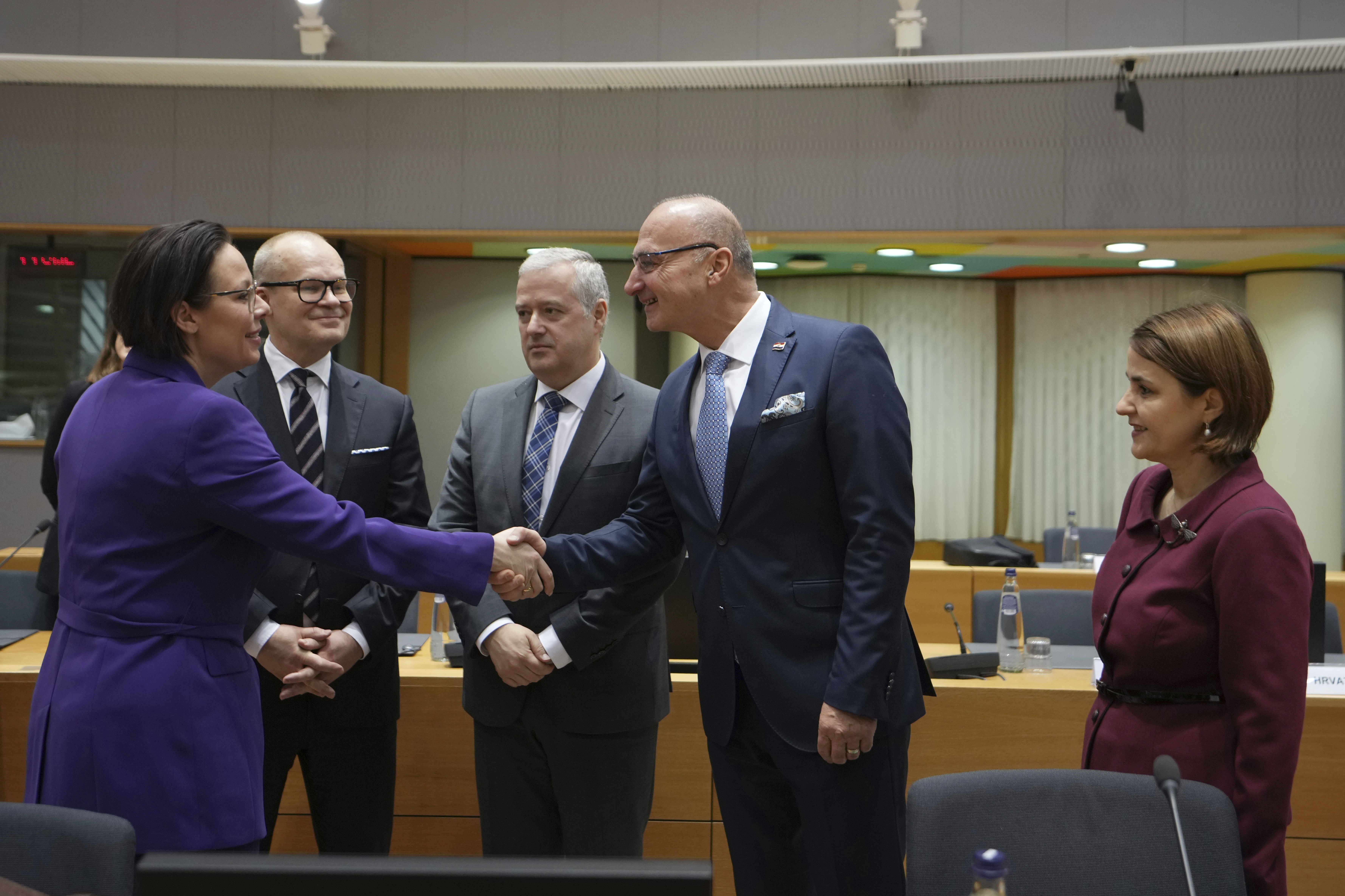 Sweden's Foreign Minister Maria Malmer Stenergard, left, shakes hands with Croatia's Foreign Minister Gordan Grlic Radman, second right, during a meeting of EU foreign ministers at the European Council building in Brussels, Monday, Dec 16, 2024. (AP Photo/Virginia Mayo)