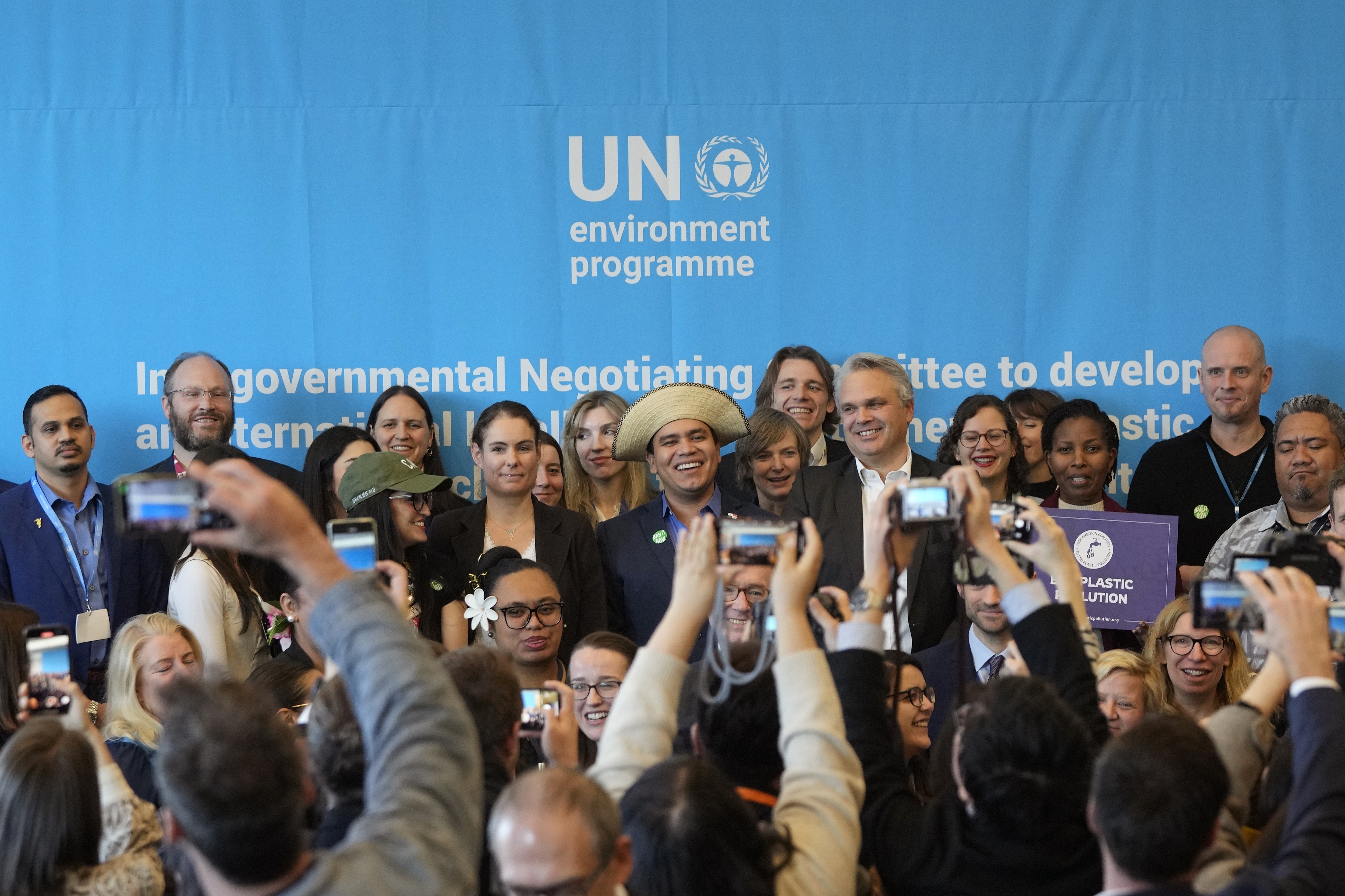 FILE - Juliet Kabera, third from right, director general of the Rwanda Environment Management Authority, Anthony Agotha, special envoy for Climate and Environment Diplomacy, European Union, Panama's Juan Carlos Monterrey, Olga Givernet, French Delegate Minister for Energy and Mexico's Camila Zepeda pose after a news conference at the fifth session of the Intergovernmental Negotiating Committee on Plastic Pollution in Busan, South Korea, Dec. 1, 2024. (AP Photo/Ahn Young-joon)