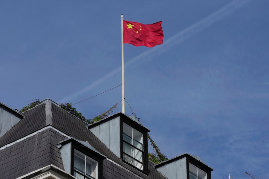 FILE - A Chinese national flag is raised at the Chinese embassy in London, Monday, Sept. 11, 2023. (AP Photo/Kin Cheung, File)