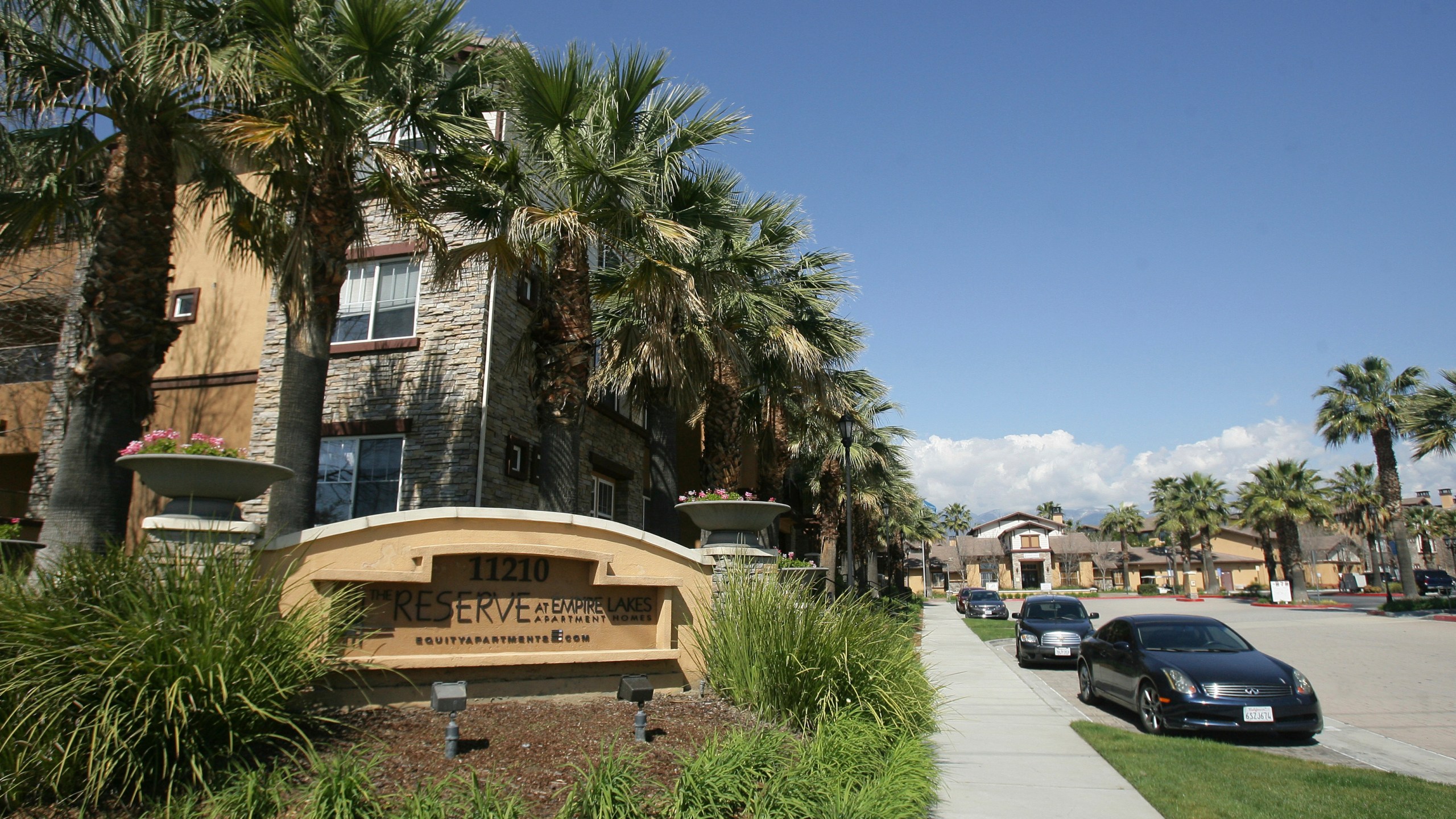 Federal agents raided about 20 locations, related to a birth tourism scheme, in three Southern California counties, including this apartment complex in Rancho Cucamonga, Calif., Tuesday, March 3, 2015. (Stan Lim/The Press-Enterprise via AP)