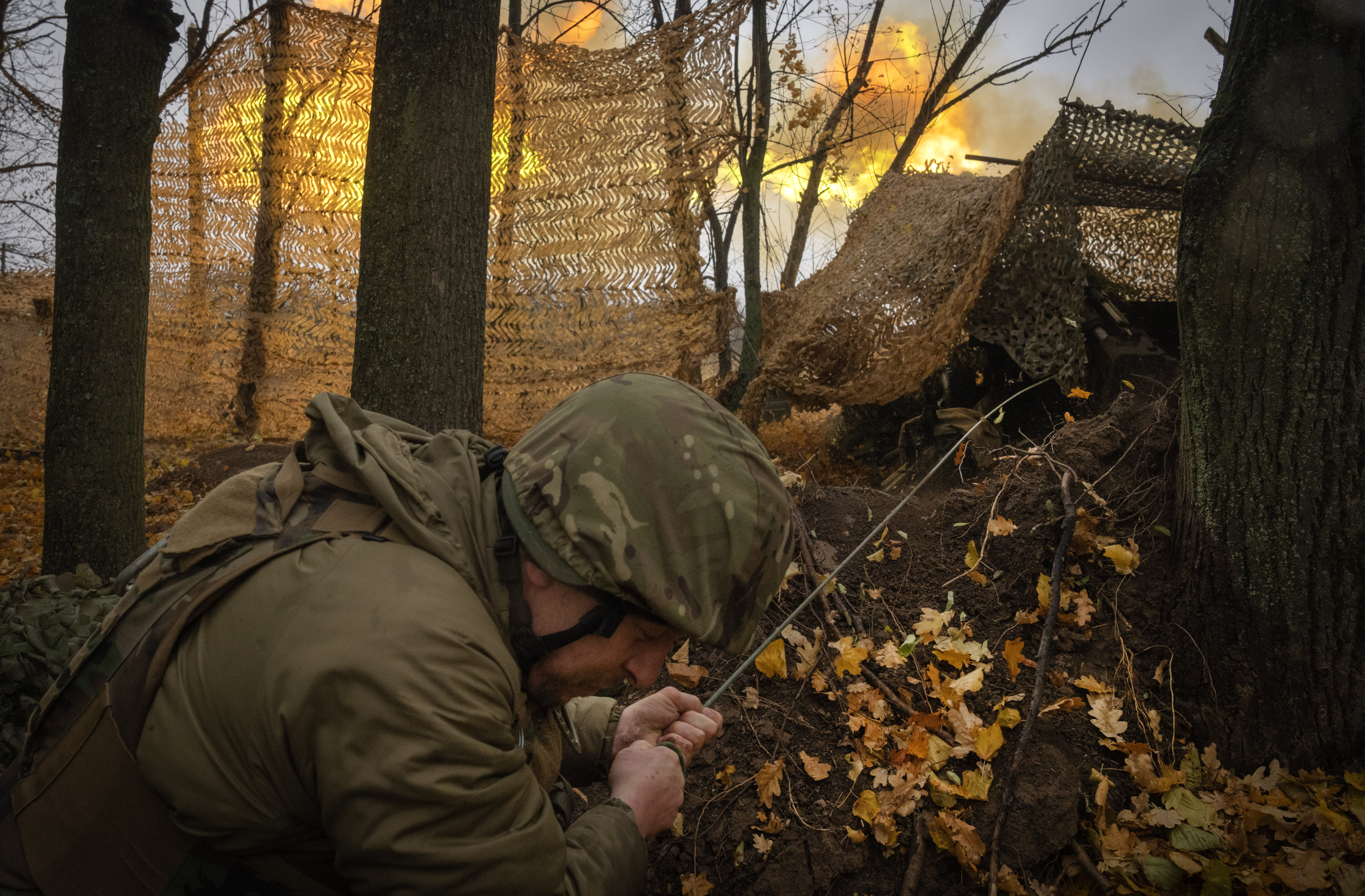 FILE - A serviceman of the 13th Brigade of the National Guard of Ukraine fires Giatsint-B gun towards Russian positions near Kharkiv, Ukraine, on Nov. 6, 2024. (AP Photo/Efrem Lukatsky, File)