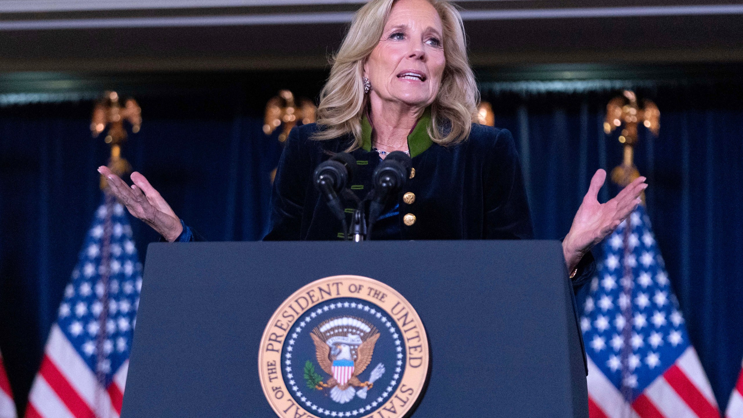 First lady Jill Biden delivers her remarks at the Democratic National Committee's Holiday Reception at Willard Hotel in Washington, Sunday, Dec. 15, 2024. (AP Photo/Jose Luis Magana)