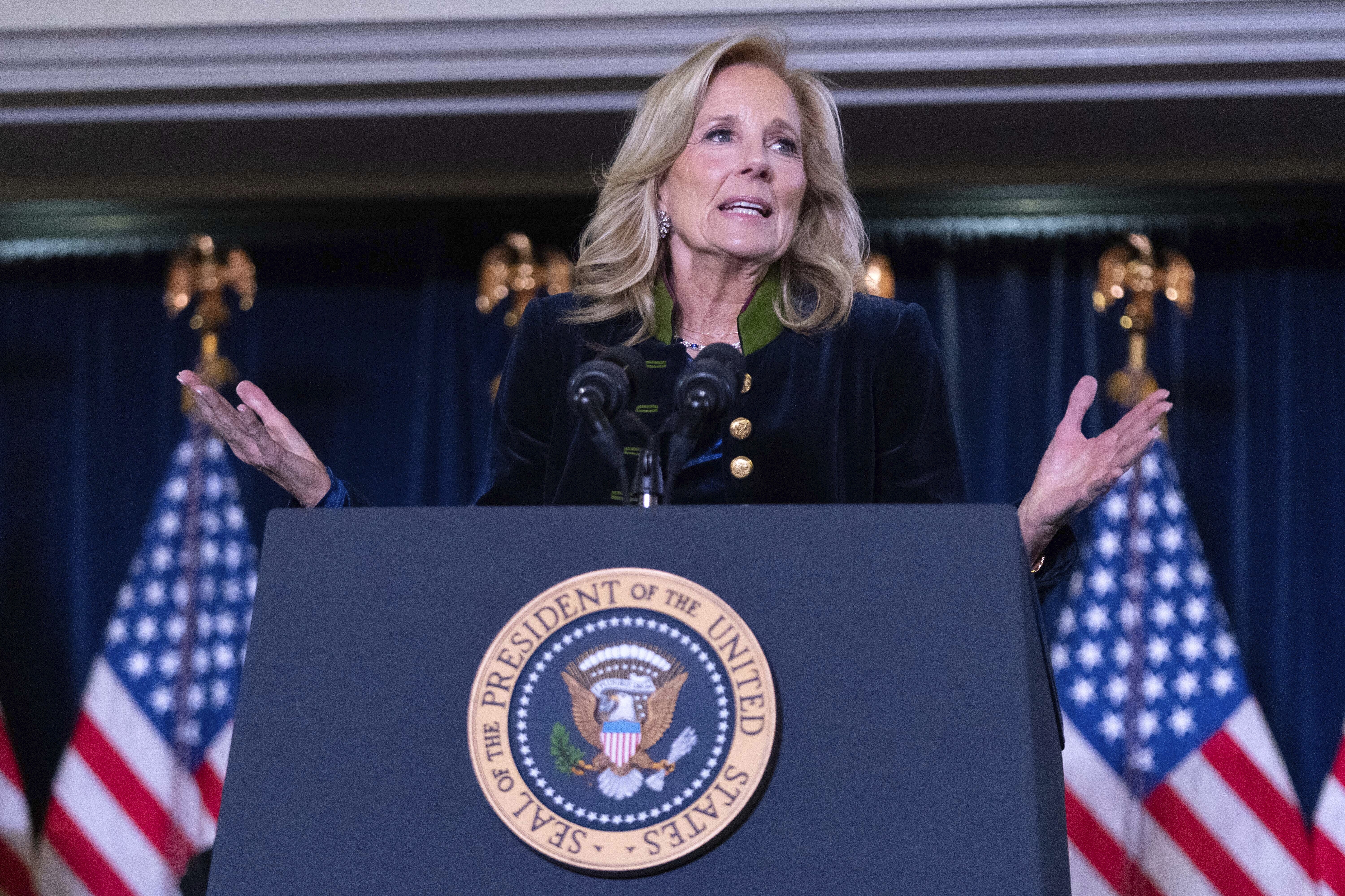 First lady Jill Biden delivers her remarks at the Democratic National Committee's Holiday Reception at Willard Hotel in Washington, Sunday, Dec. 15, 2024. (AP Photo/Jose Luis Magana)