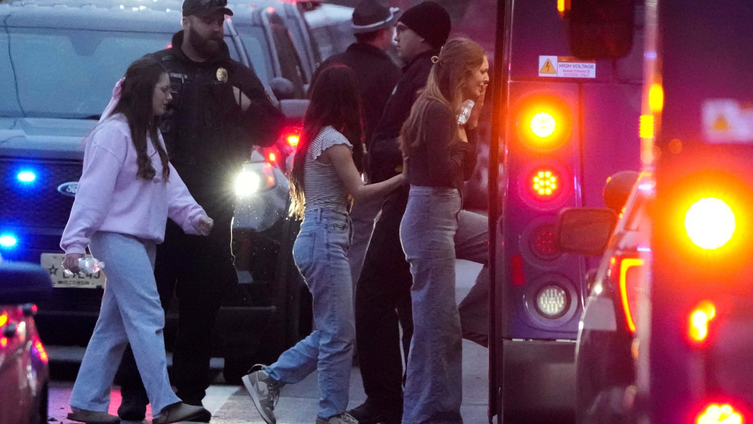 Students aboard a bus as they leave the shelter following a shooting at the Abundant Life Christian School, Monday, Dec. 16, 2024. (AP Photo/Morry Gash)