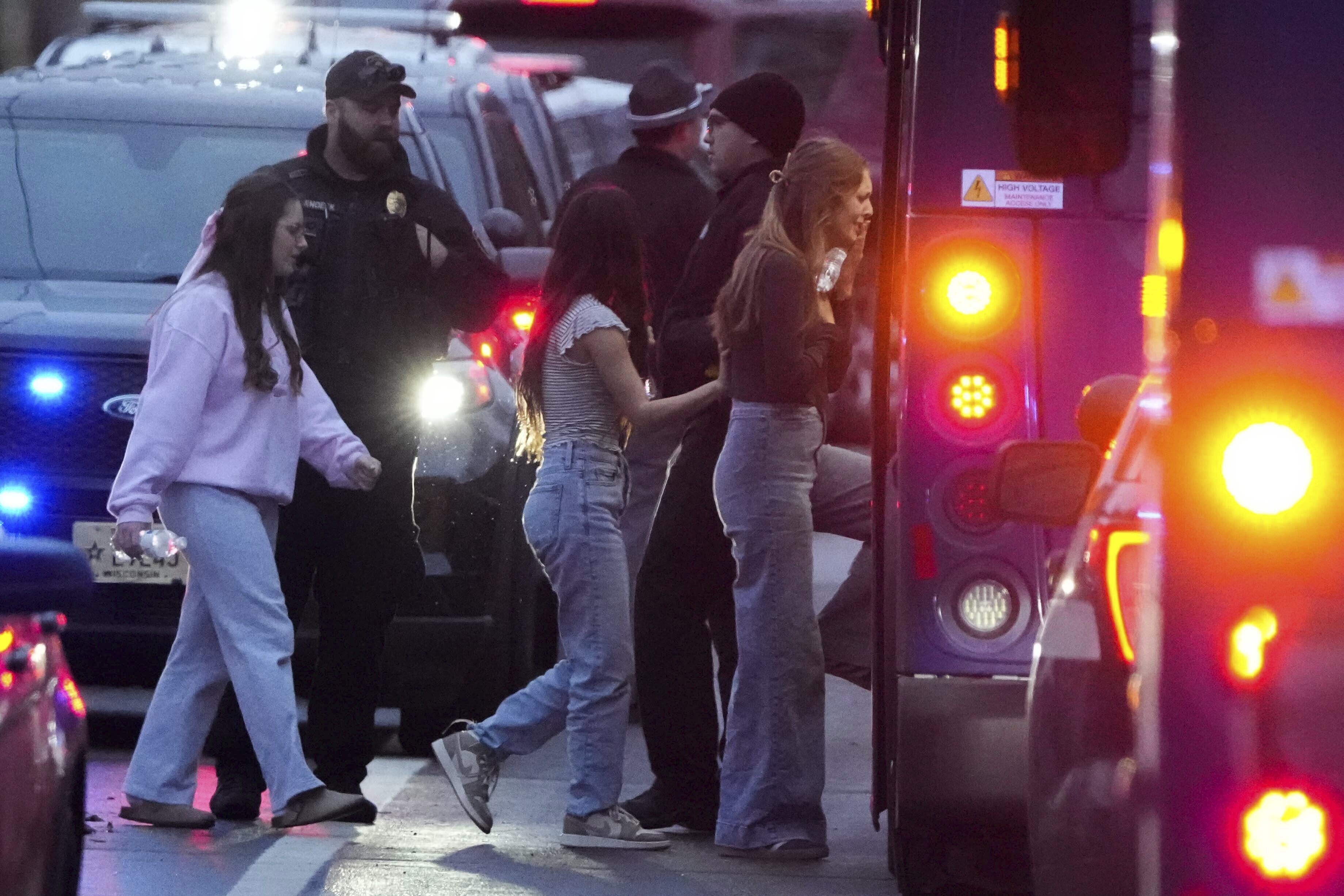 Students aboard a bus as they leave the shelter following a shooting at the Abundant Life Christian School, Monday, Dec. 16, 2024. (AP Photo/Morry Gash)