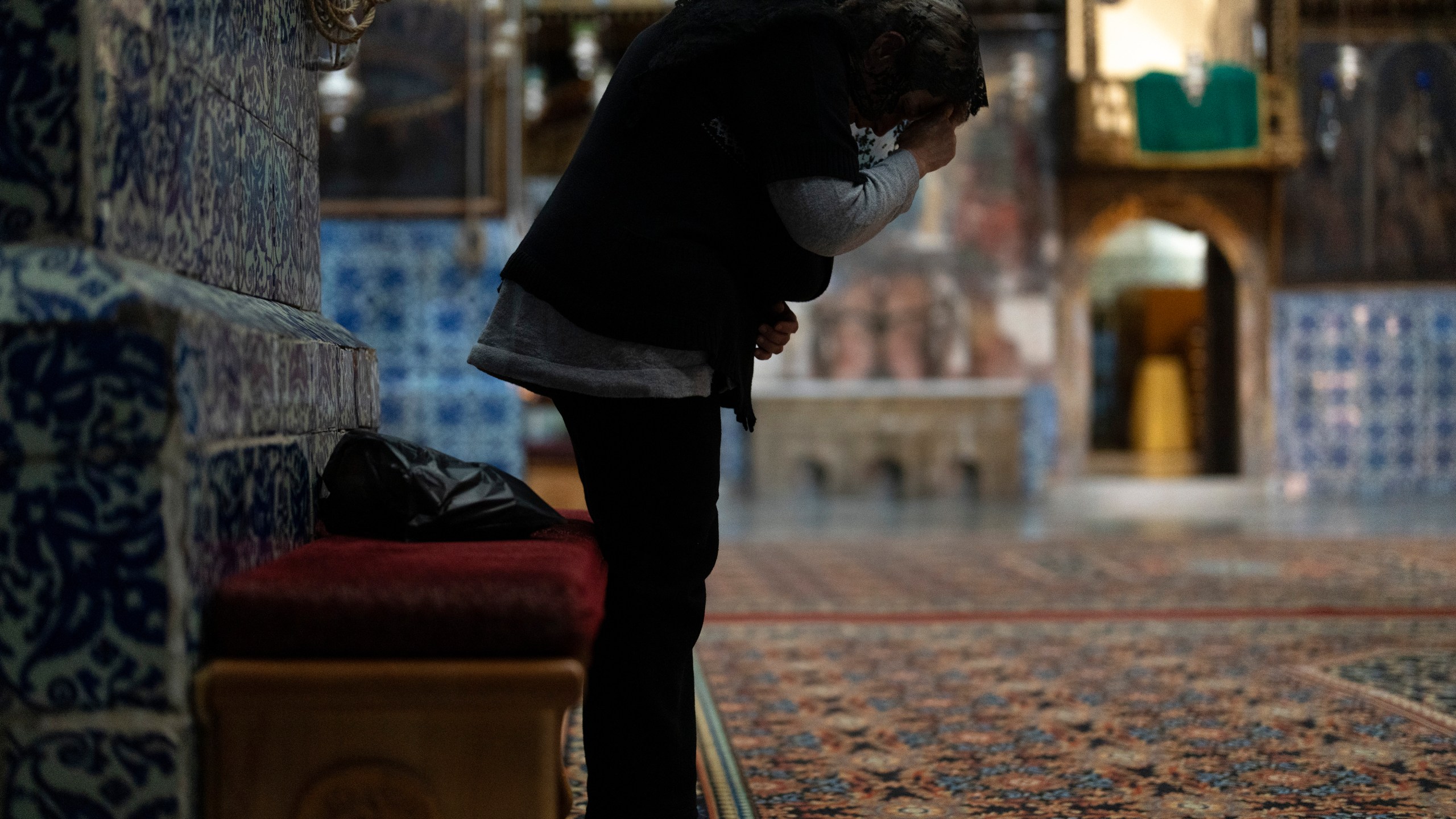 An Armenian Christian worshipper attends the daily afternoon prayer service at the St. James Cathedral at the Armenian quarter in Jerusalem, Thursday, Nov. 21, 2024. (AP Photo/Francisco Seco)