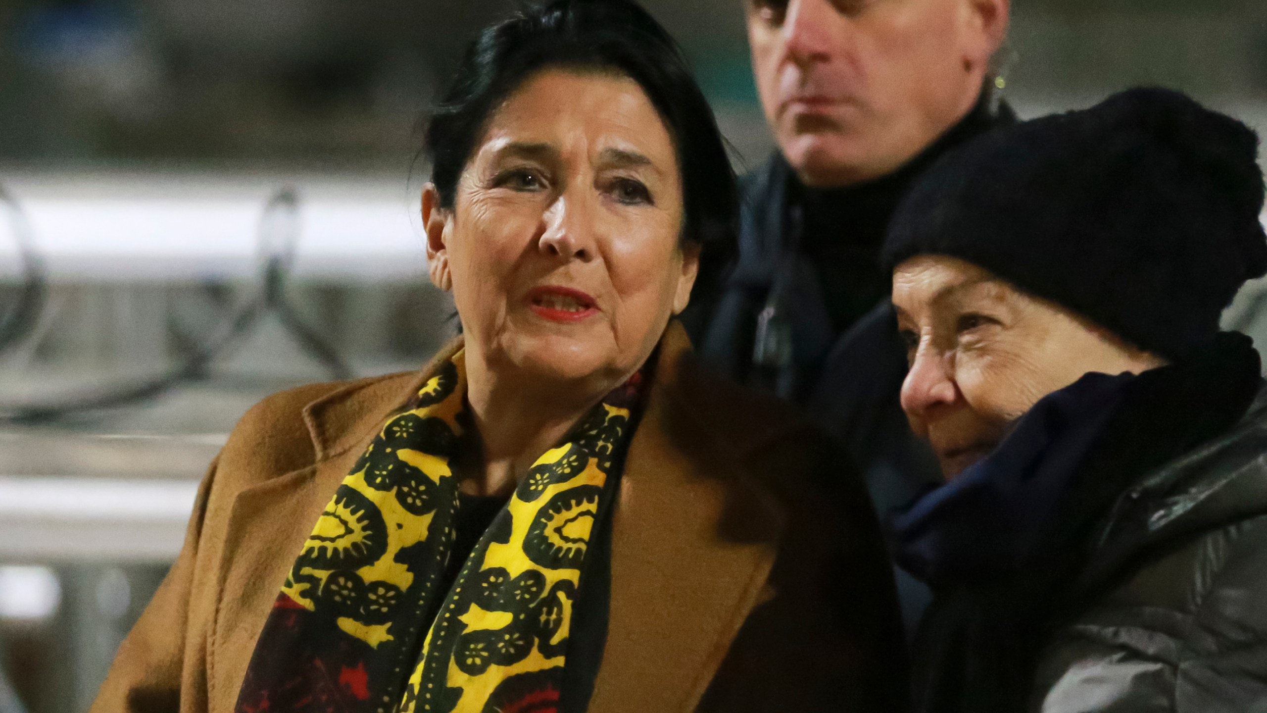 Georgian President Salome Zourabichvili, left, attends an anti-government rally outside the Parliament building in Tbilisi, Georgia, on Saturday, Dec. 14, 2024. (AP Photo/Zurab Tsertsvadze)