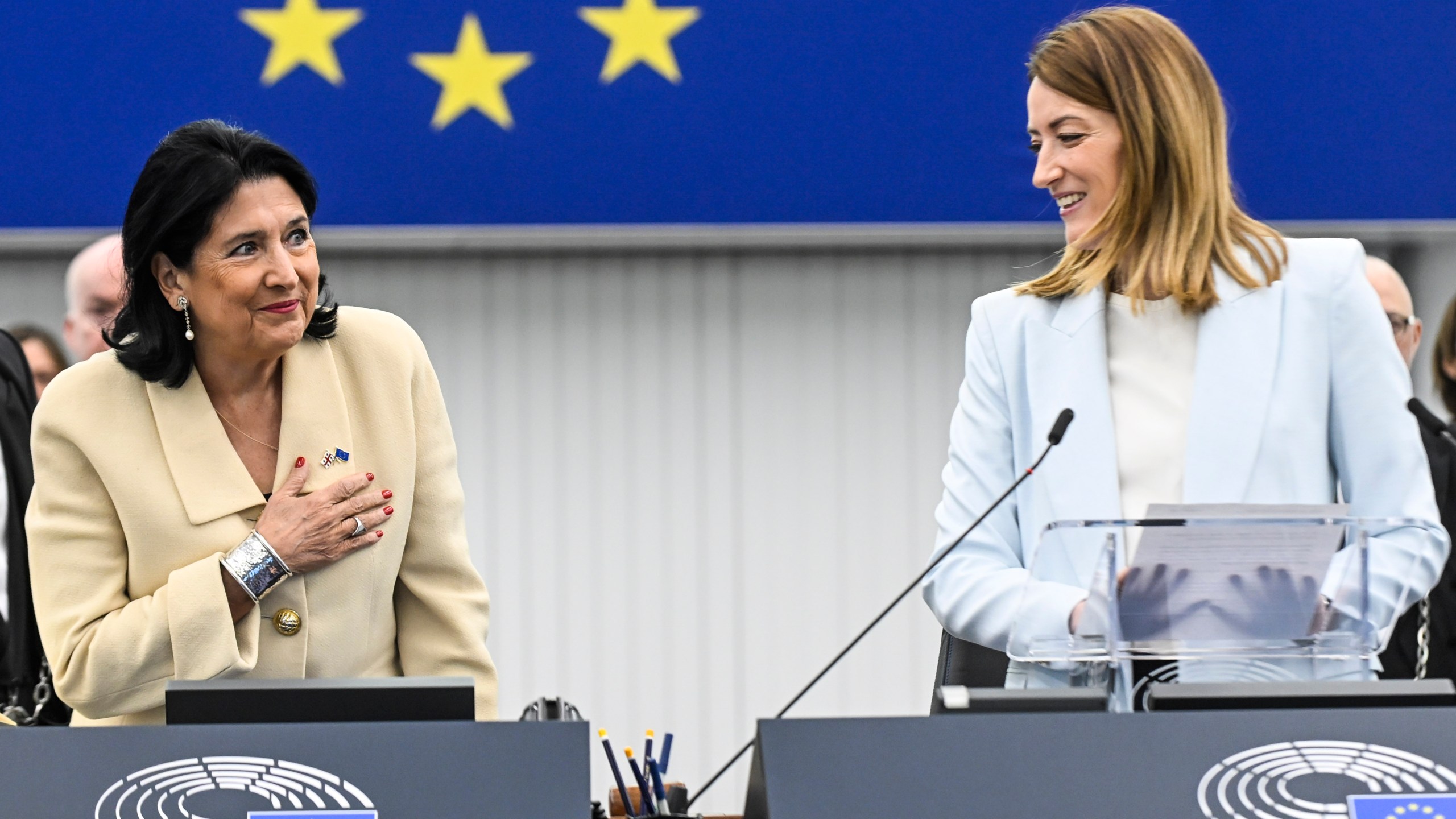 Georgian outgoing President Salome Zourabichvili , left, gestures as European Parliament president Roberta Metsola looks on, Wednesday, Dec. 18, 2024 in Strasbourg, eastern France. (AP Photo/Pascal Bastien)