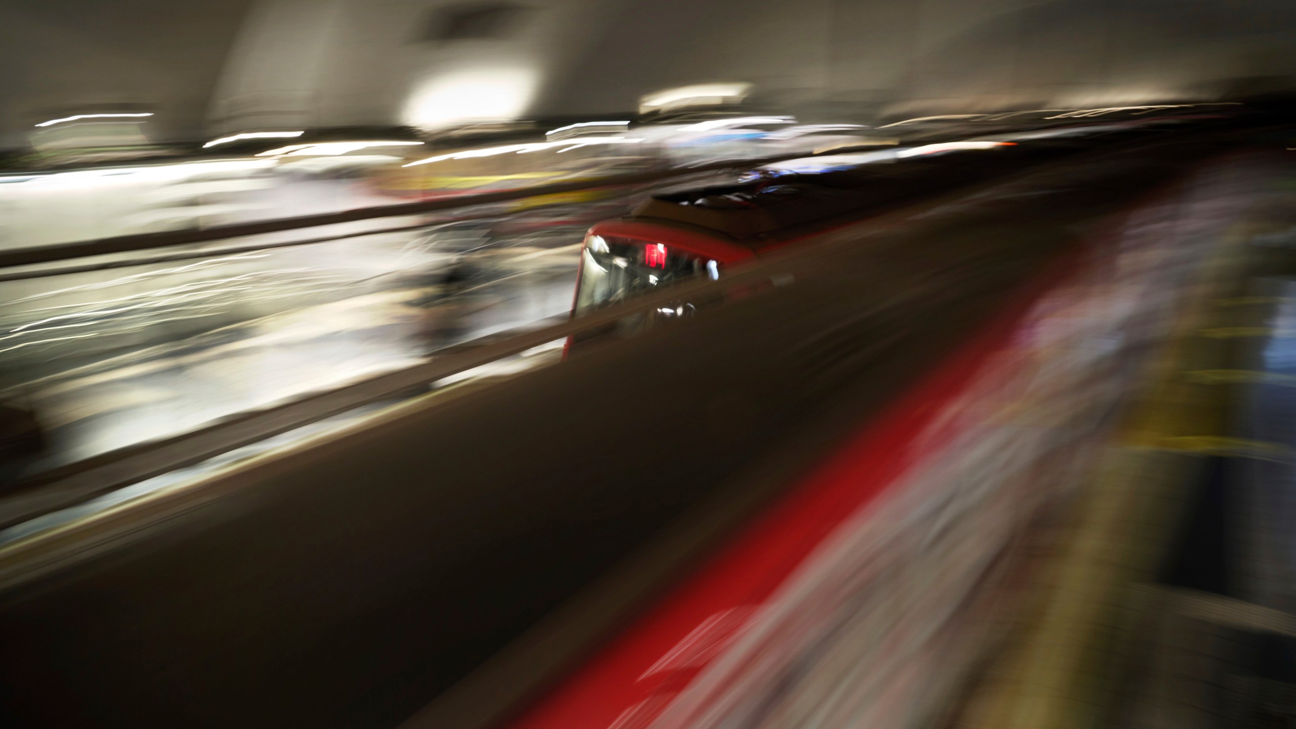 Metro trains come and go picking up and dropping off passengers at a Barcelona metro station Spain, Monday, Dec. 2, 2024. (AP Photo/Emilio Morenatti)