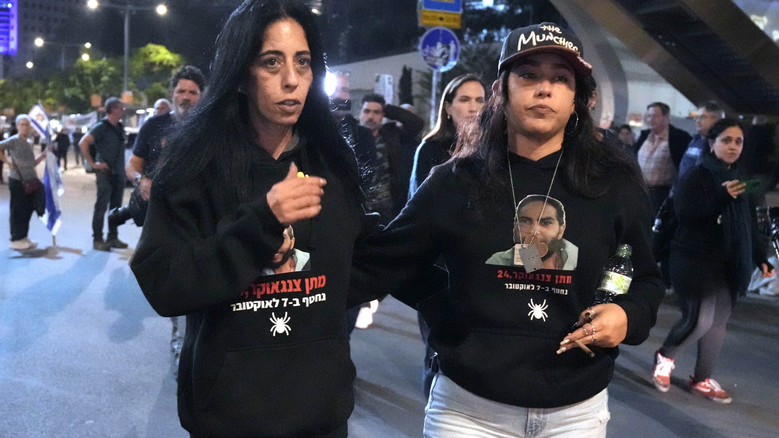 FILE - Einav Zangauker, left, mother of Israeli hostage Matan Zangauker, and his partner, Ilana Gritzewsky, protest in Tel Aviv, Israel, on Saturday, Dec. 7, 2024, in support of hostages held by Hamas in Gaza. (AP Photo/Mahmoud Illean, File)