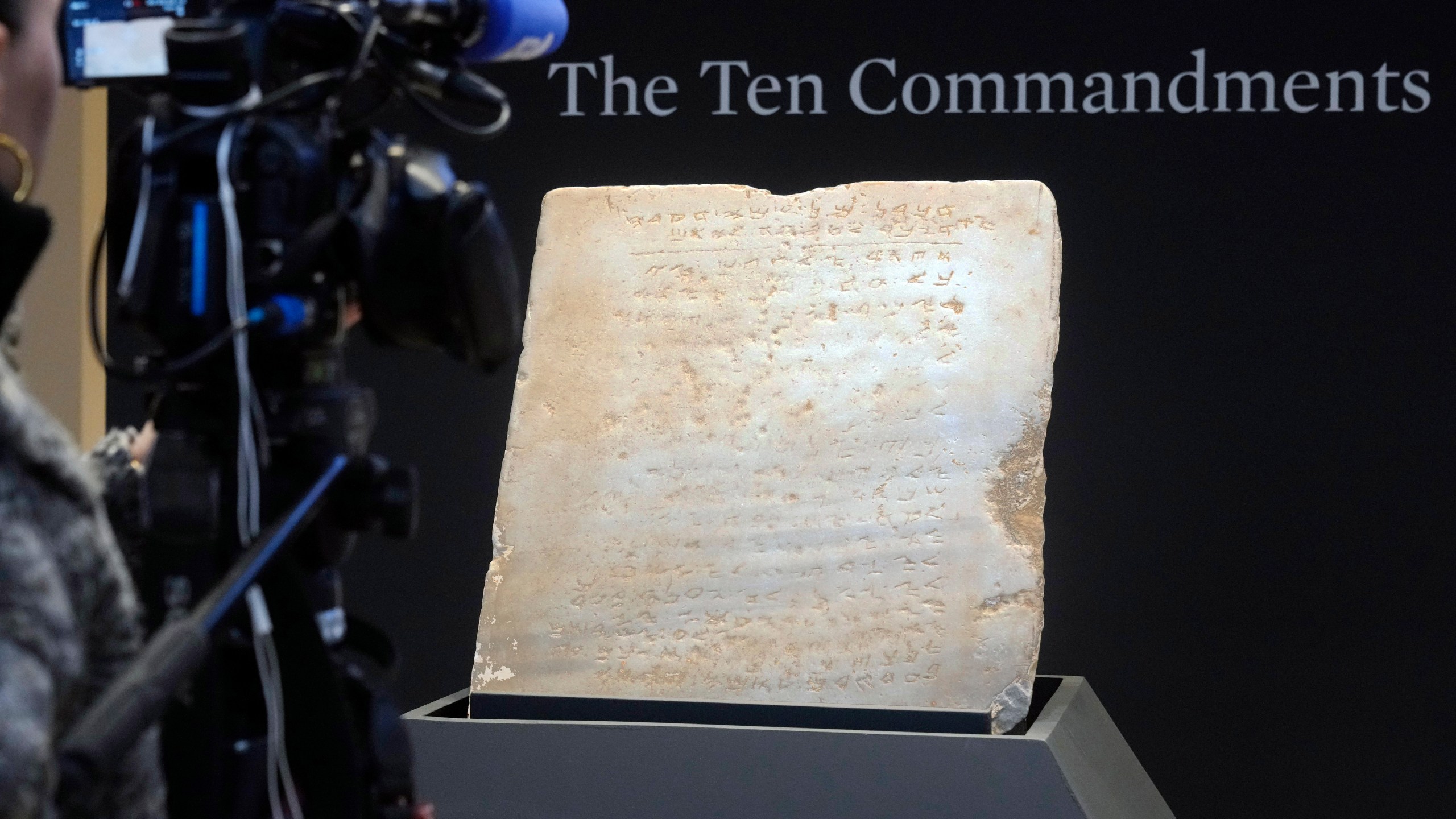 The oldest complete tablet of the Ten Commandments, weighing 115-pounds and approximately 1,500 years old, is displayed at Sotheby's, in New York, Monday, Dec. 9, 2024, where it is to be offered for auction in a single lot sale, Dec, 18, 2024. (AP Photo/Richard Drew)