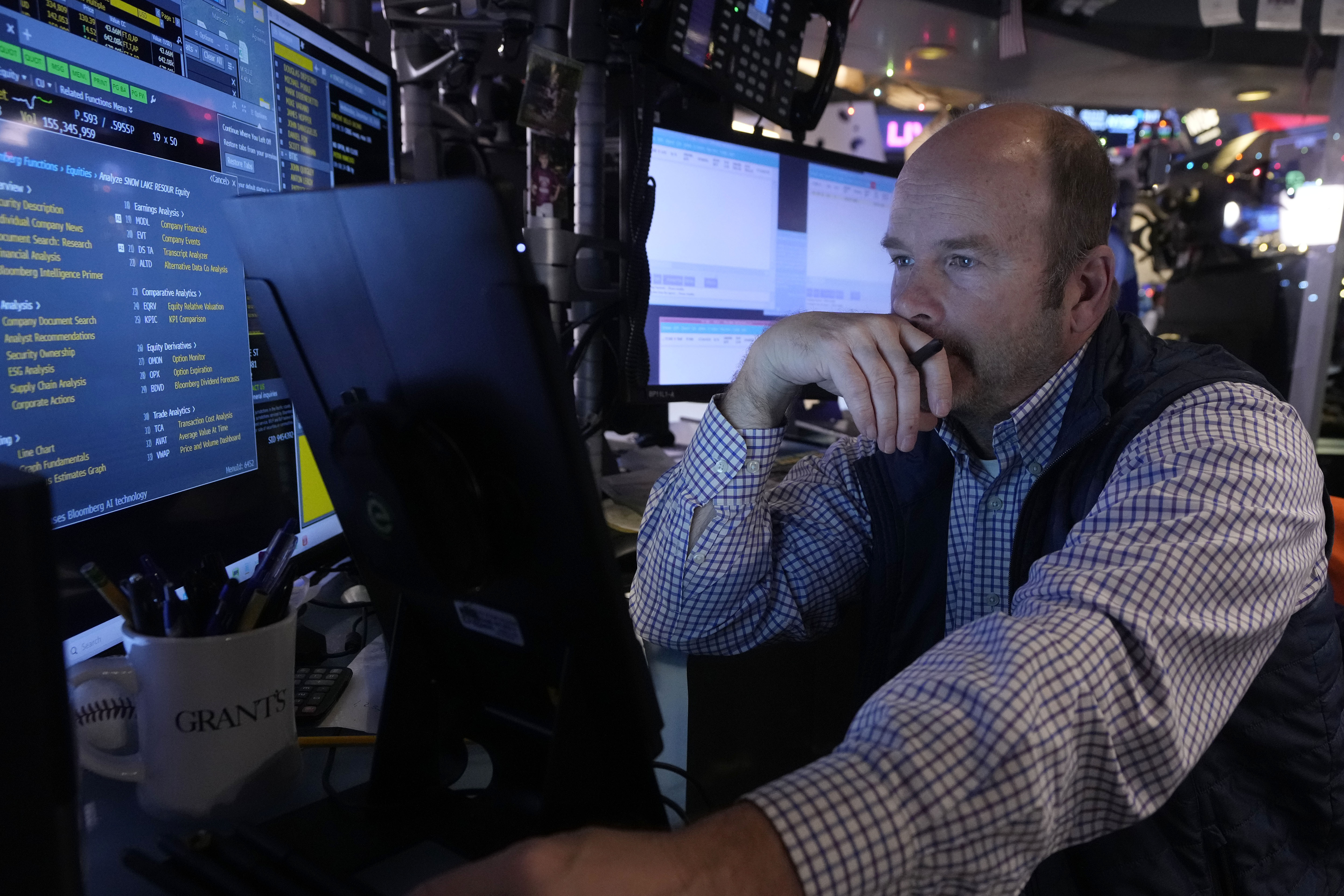 Trader Peter Mancuso works on the floor of the New York Stock Exchange, Wednesday, Dec. 18, 2024. (AP Photo/Richard Drew)