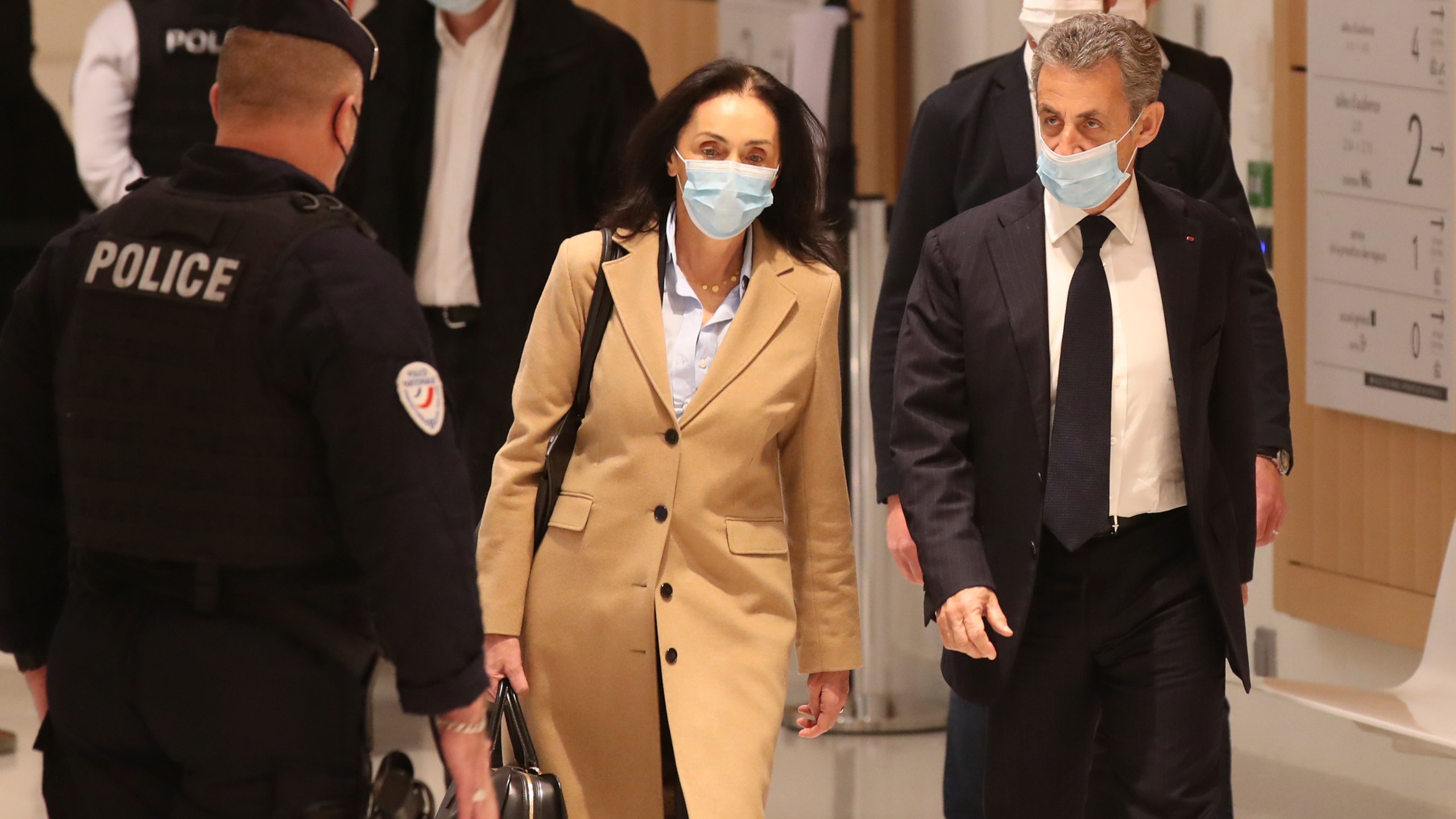 FILE - Former French President Nicolas Sarkozy, right, and his lawyer Jacqueline Laffont, center, arrive at the courtroom, Monday, Nov. 23, 2020 in Paris. (AP Photo/Michel Euler, File)