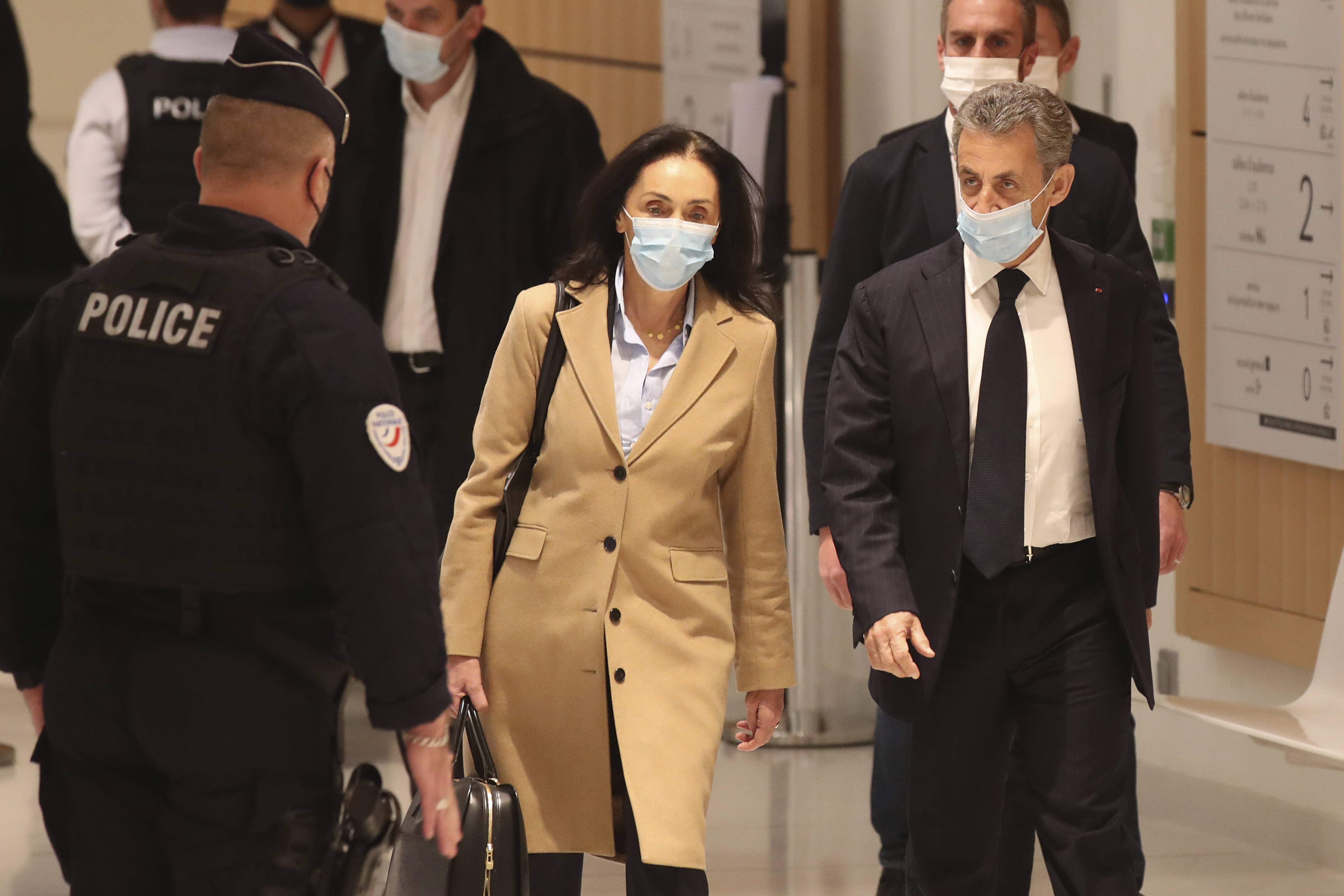 FILE - Former French President Nicolas Sarkozy, right, and his lawyer Jacqueline Laffont, center, arrive at the courtroom, Monday, Nov. 23, 2020 in Paris. (AP Photo/Michel Euler, File)