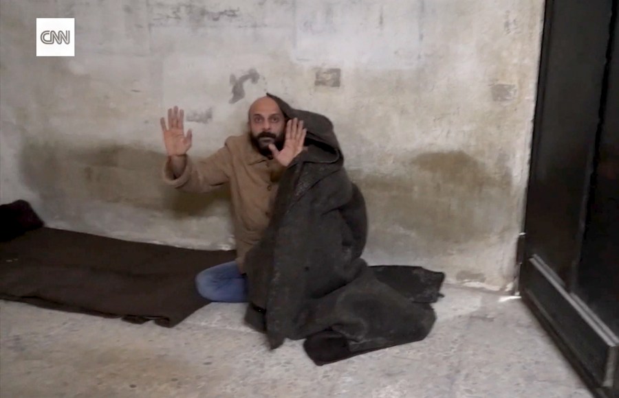 This image taken from vide provided by CNN shows a man who was freed after reporter Clarissa Ward and a Syrian rebel guard discovered him locked in a Damascus prison. It was featured in a story that ran in early December 2024, but CNN has since discovered that the prisoner had lied about his identity. (CNN via AP)