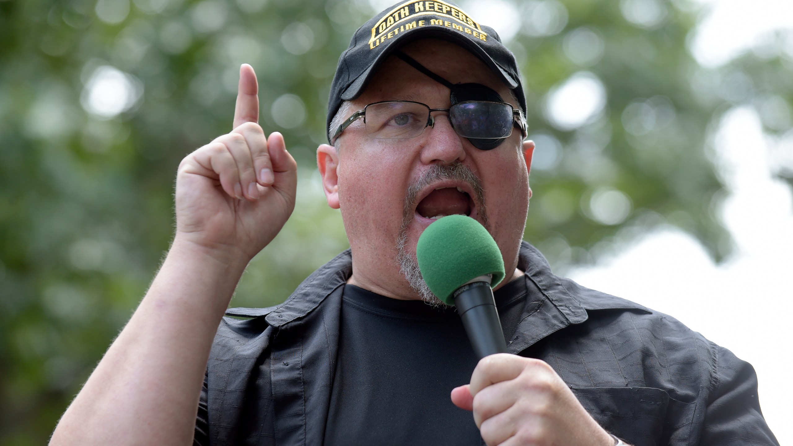 FILE - Stewart Rhodes, founder of the Oath Keepers, speaks during a rally outside the White House in Washington, June 25, 2017. (AP Photo/Susan Walsh, File)