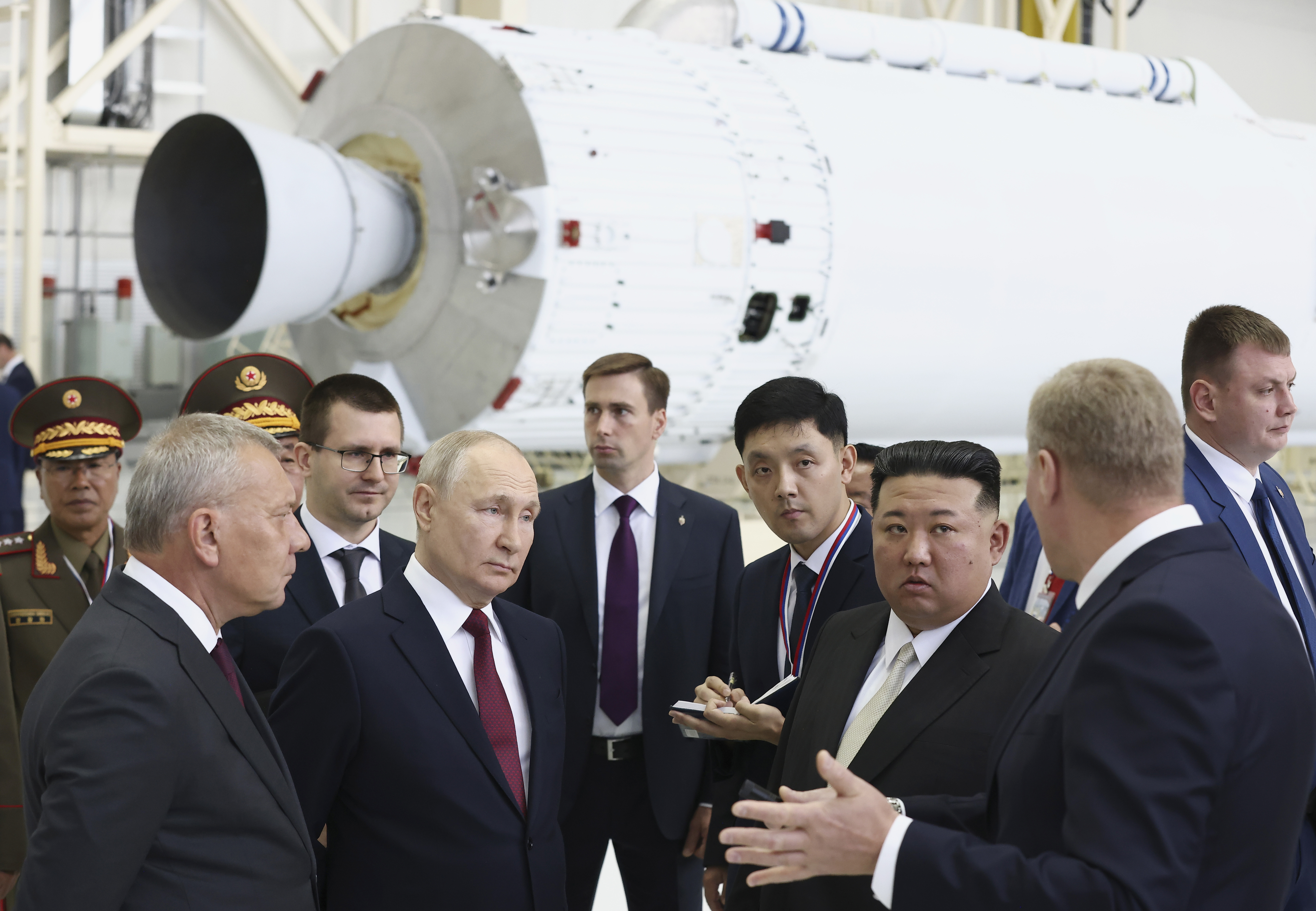 FILE - Russian President Vladimir Putin, second left in front, and North Korea's leader Kim Jong Un, second right in front, examine a rocket assembly hangar during their meeting at the Vostochny cosmodrome outside the city of Tsiolkovsky, about 200 kilometers (125 miles) from the city of Blagoveshchensk in the far eastern Amur region, Russia, Sept. 13, 2023. Russian Federal Space Corporation Roscosmos CEO Yuri Borisov is on the left. (Artyom Geodakyan, Sputnik, Kremlin Pool Photo via AP, File)