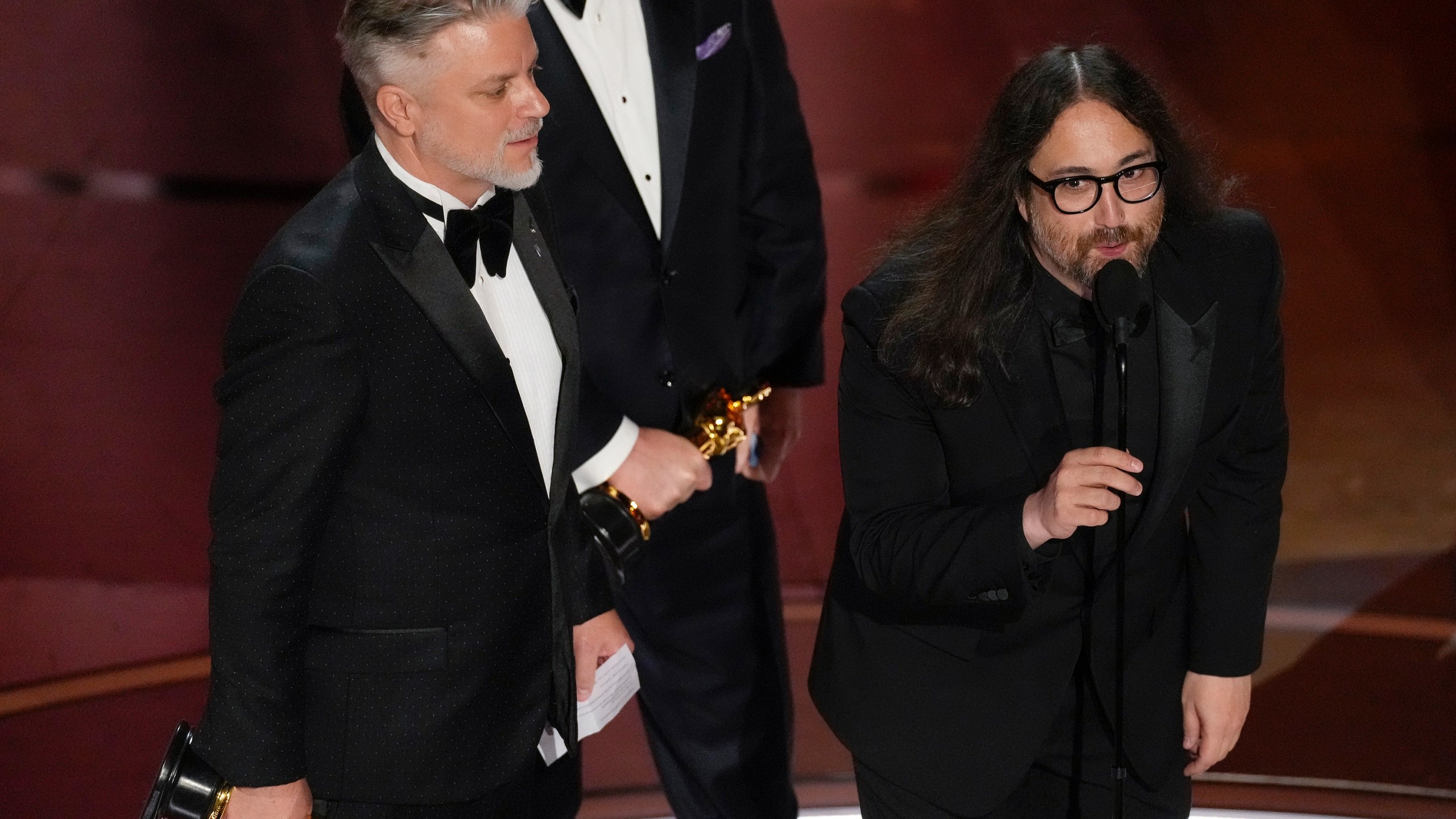 FILE - Dave Mullins, left, and Sean Ono Lennon accept the award for best animated short for "War Is Over! Inspired by the Music of John & Yoko" during the Oscars on March 10, 2024, in Los Angeles. (AP Photo/Chris Pizzello, File)