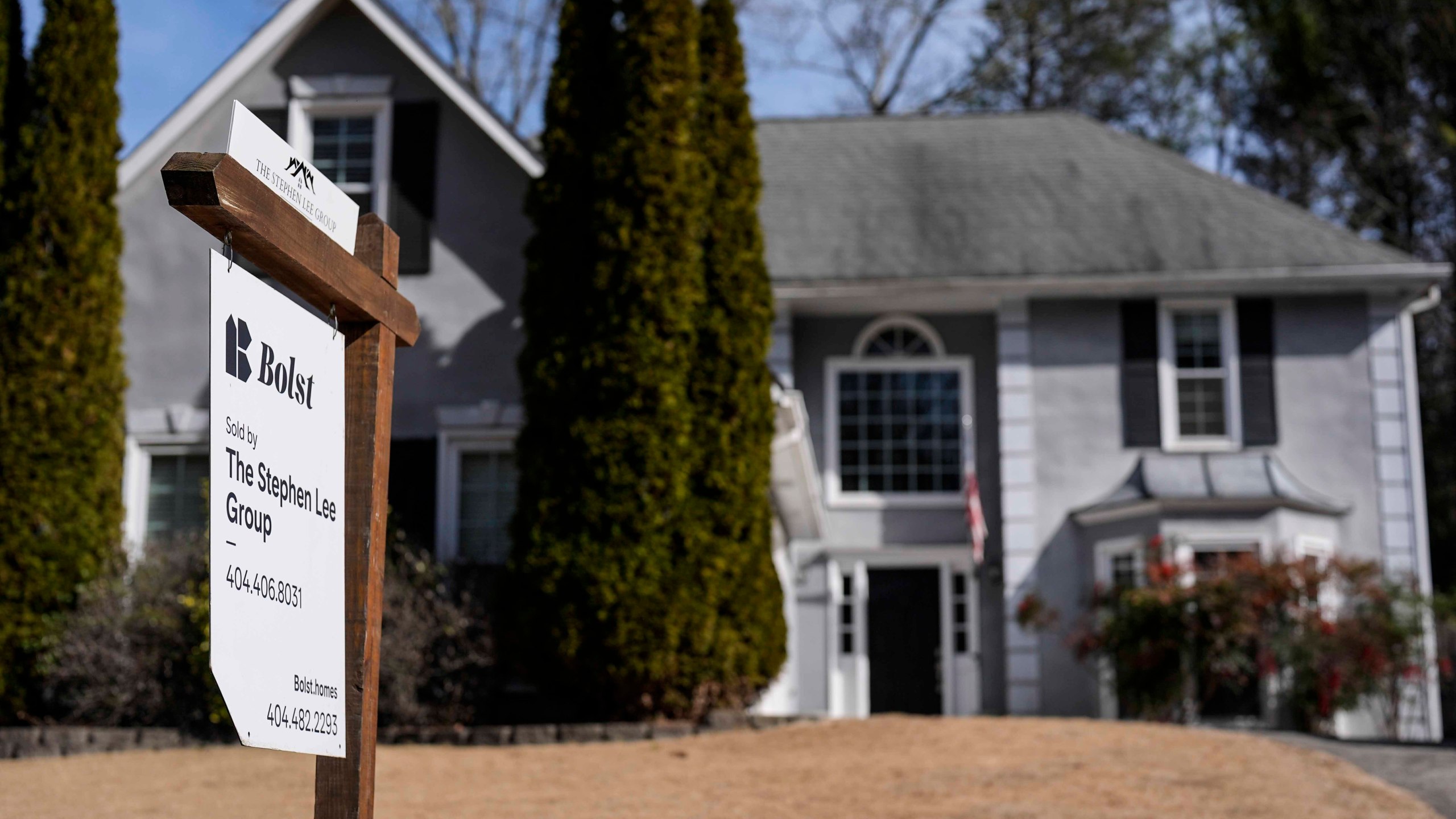 FILE - A sign announcing a home for sale is posted outside a home, Feb. 1, 2024, in Kennesaw, Ga. (AP Photo/Mike Stewart, File)