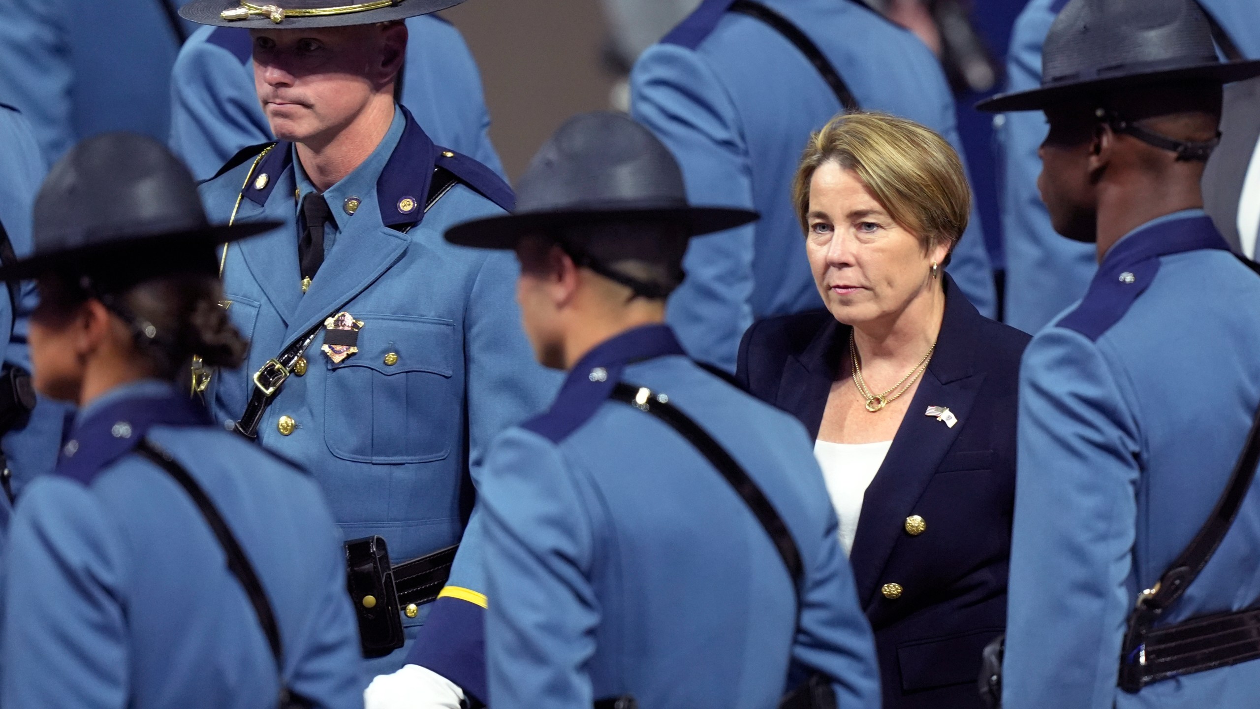 FILE - Massachusetts Gov. Maura Healey, right, walks among members of the 90th Recruit Training Group of the Massachusetts State Police, during a swearing in ceremony in Worcester, Mass., Oct. 9, 2024. (AP Photo/Steven Senne, File)