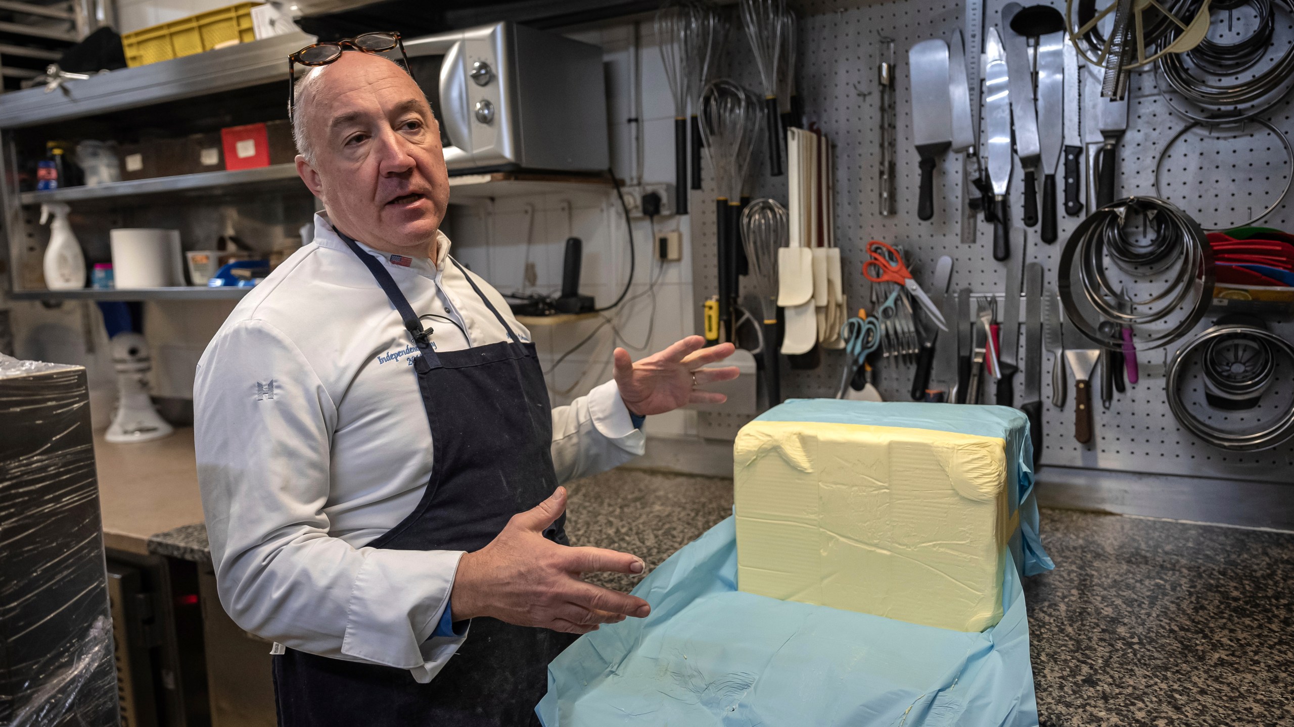 French baker Arnaud Delmontel talks about butter, its price and quality in his bakery in Paris, Monday, Dec. 16, 2024 as butter has shot up in price across Europe in recent months, adding more pain to consumers this holiday season after years of inflation in the wake of the COVID-19 pandemic and war in Ukraine.(AP Photo/Aurelien Morissard)